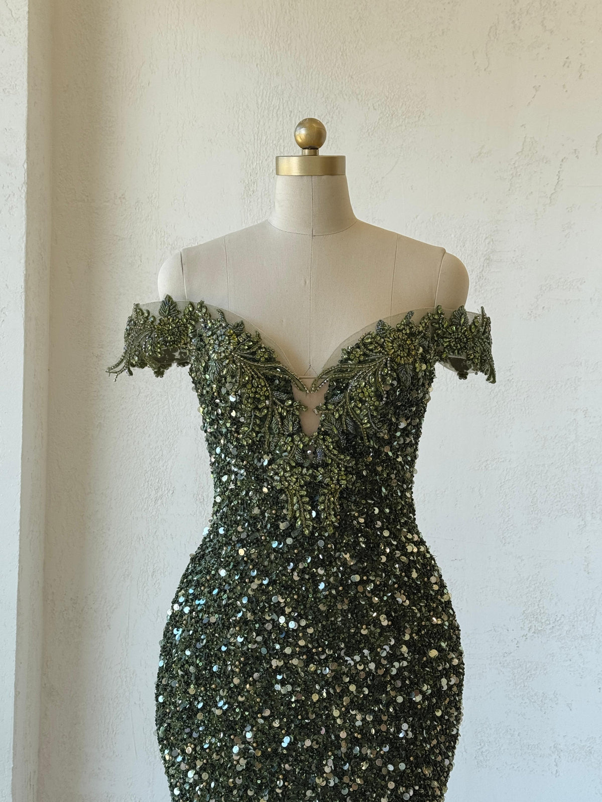 Green mermaid gown with off the shoulder sleeves, v-neck, embroidery and sequins