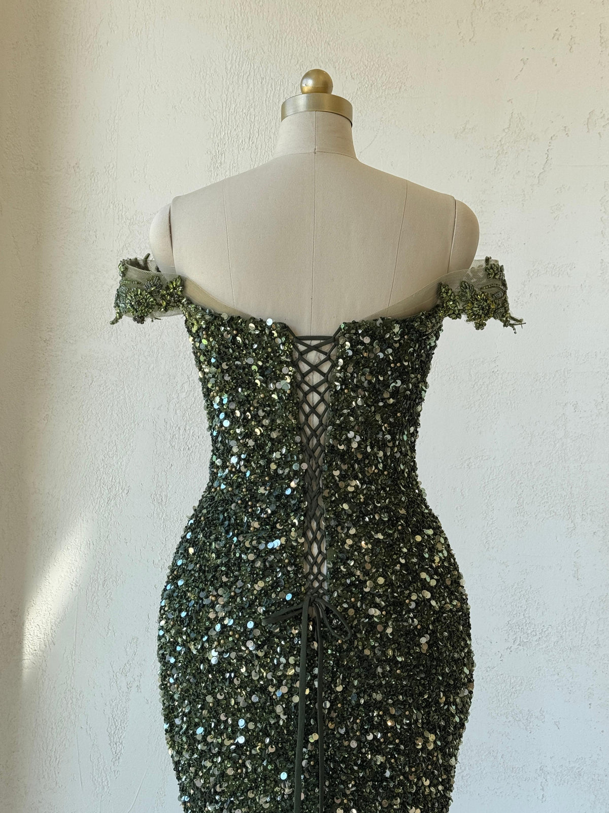 Green mermaid gown with off the shoulder sleeves, v-neck, embroidery and sequins