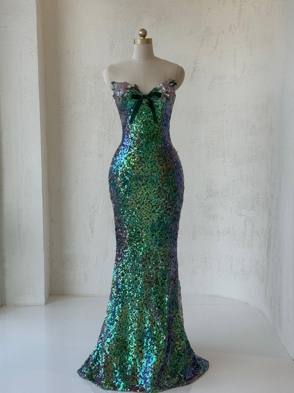 Green mermaid gown with embroidery, sequins and no sleeves or straps