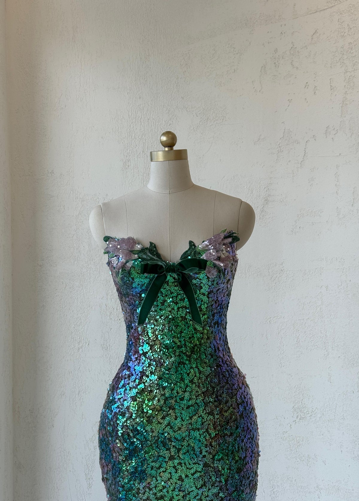 Green mermaid gown with embroidery, sequins and no sleeves or straps
