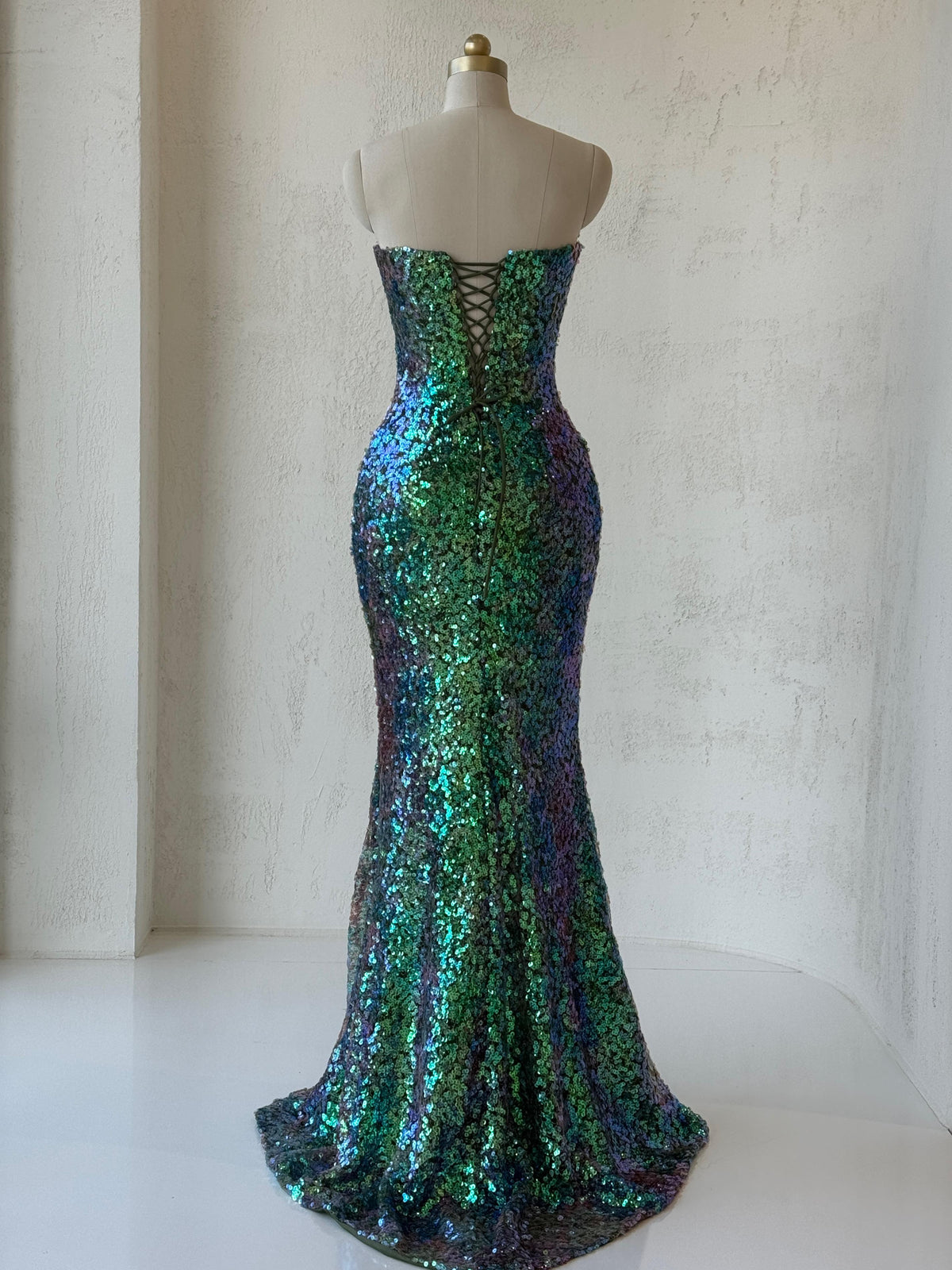 Green mermaid gown with embroidery, sequins and no sleeves or straps