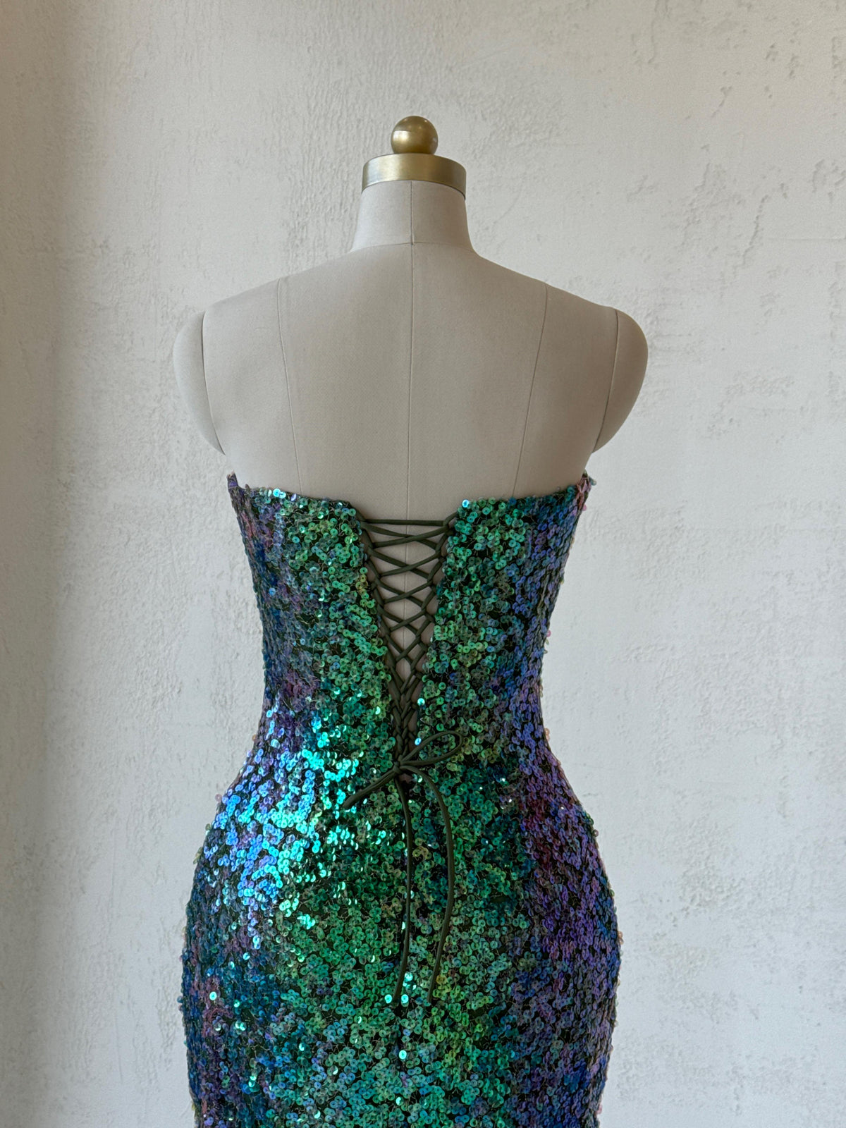 Green mermaid gown with embroidery, sequins and no sleeves or straps