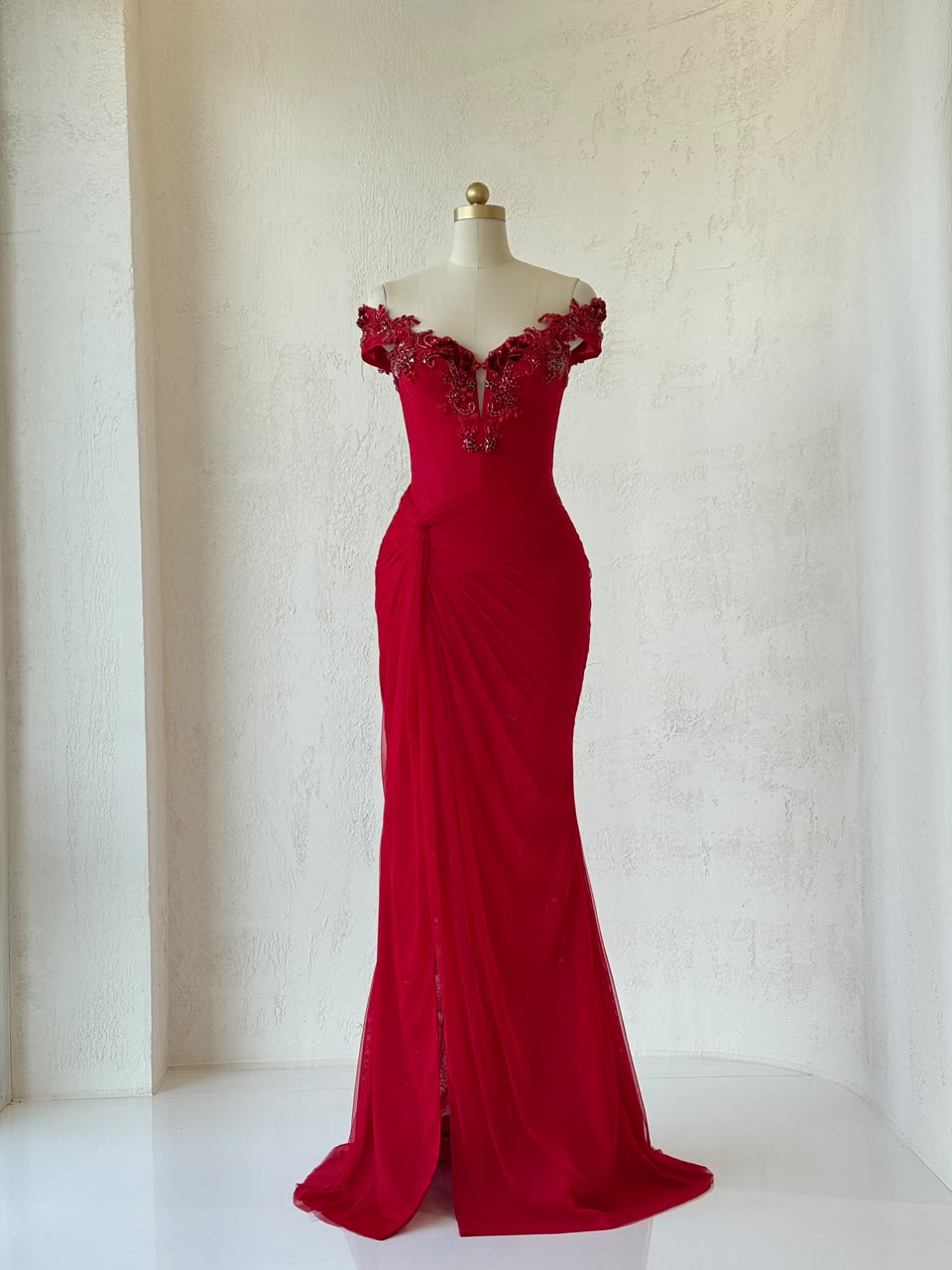 Red mermaid gown with off the shoulder straps and embroidery