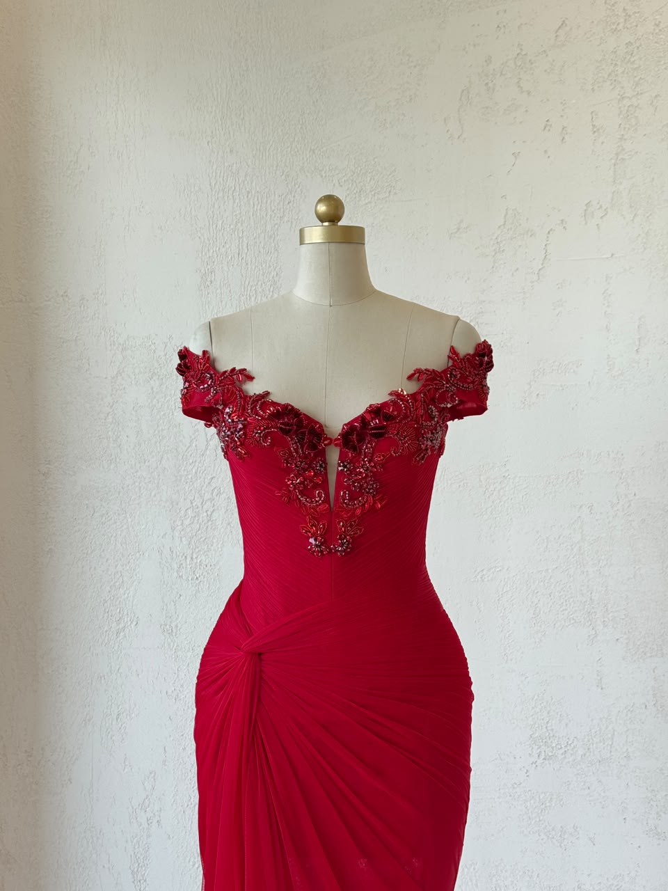 Red mermaid gown with off the shoulder straps and embroidery