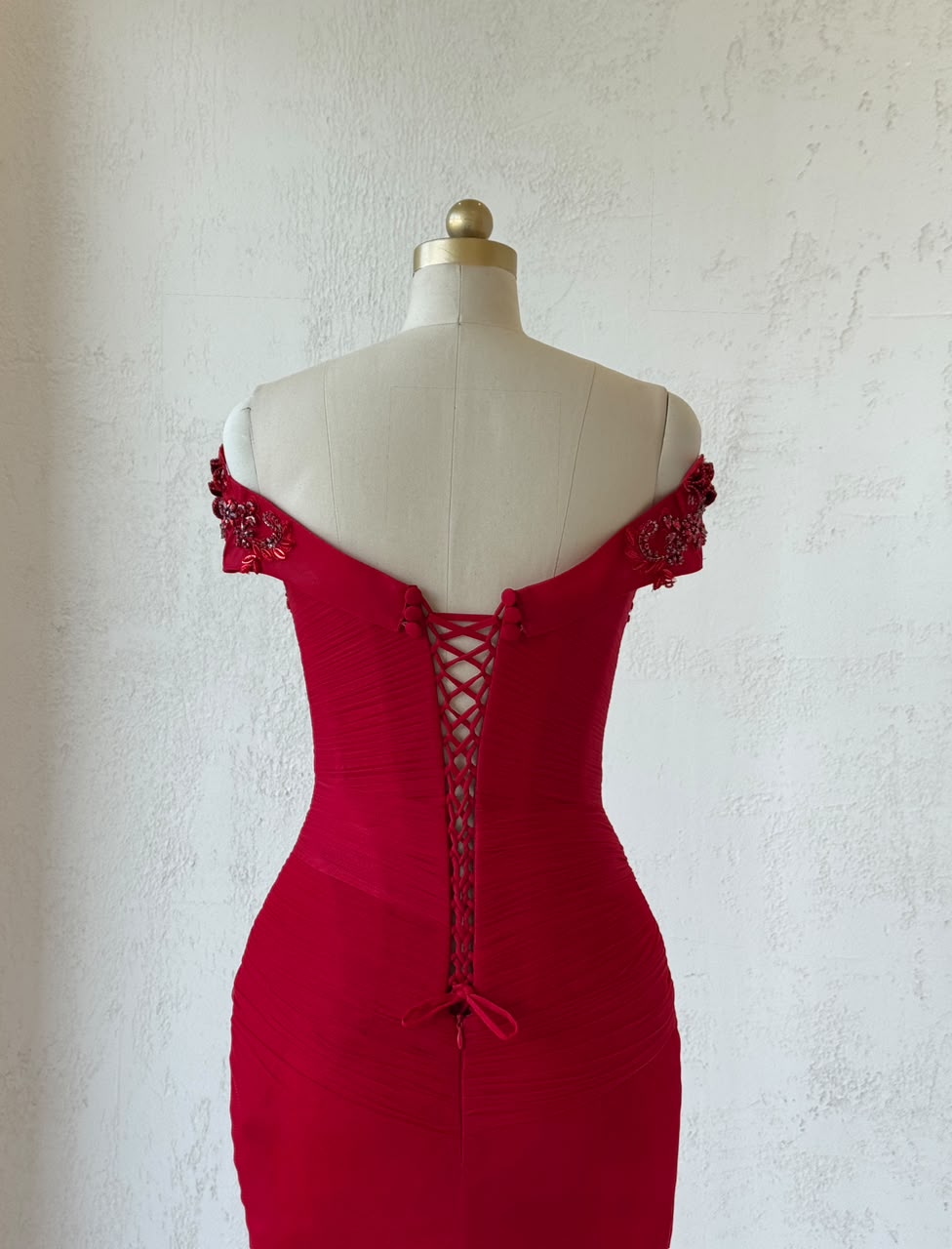 Red mermaid gown with off the shoulder straps and embroidery