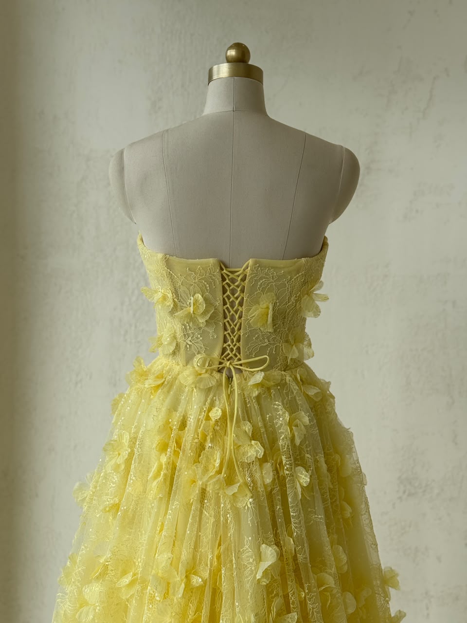 Yellow A-Line gown with embroidery and no sleeves