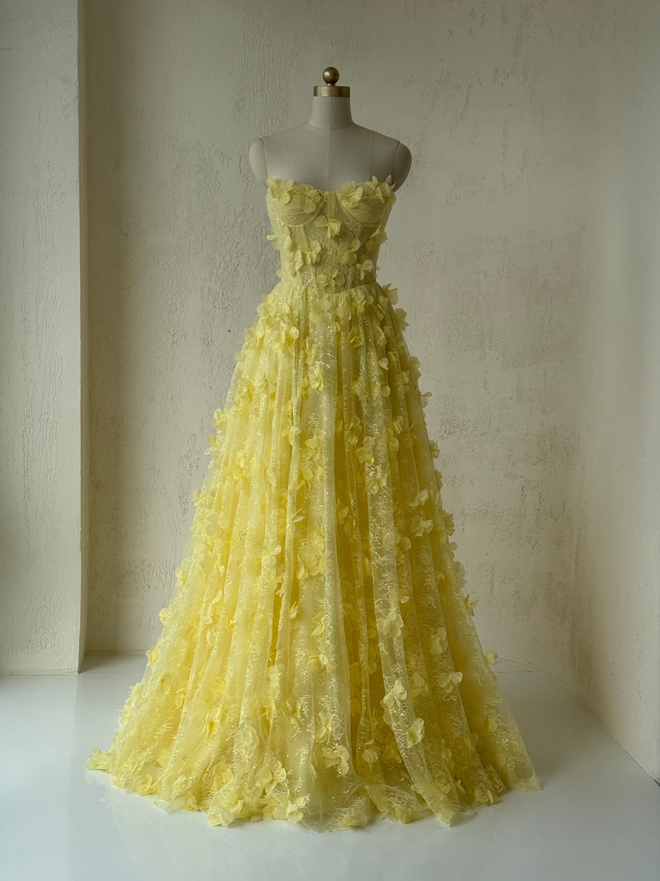Yellow A-Line gown with embroidery and no sleeves