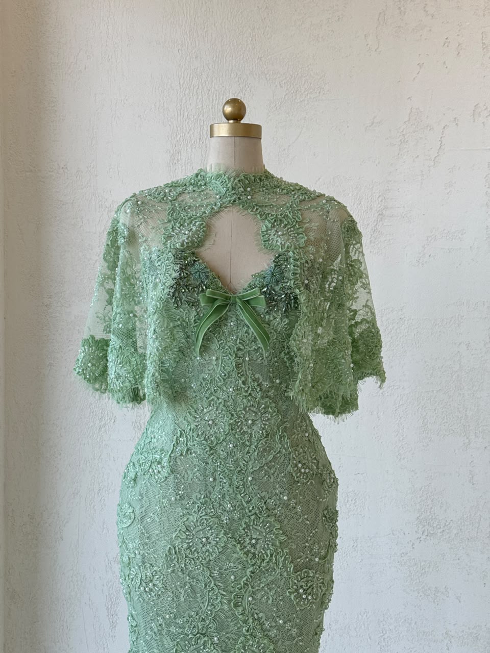 Green mermaid gown with embroidery, beading, lace, bolero and bow