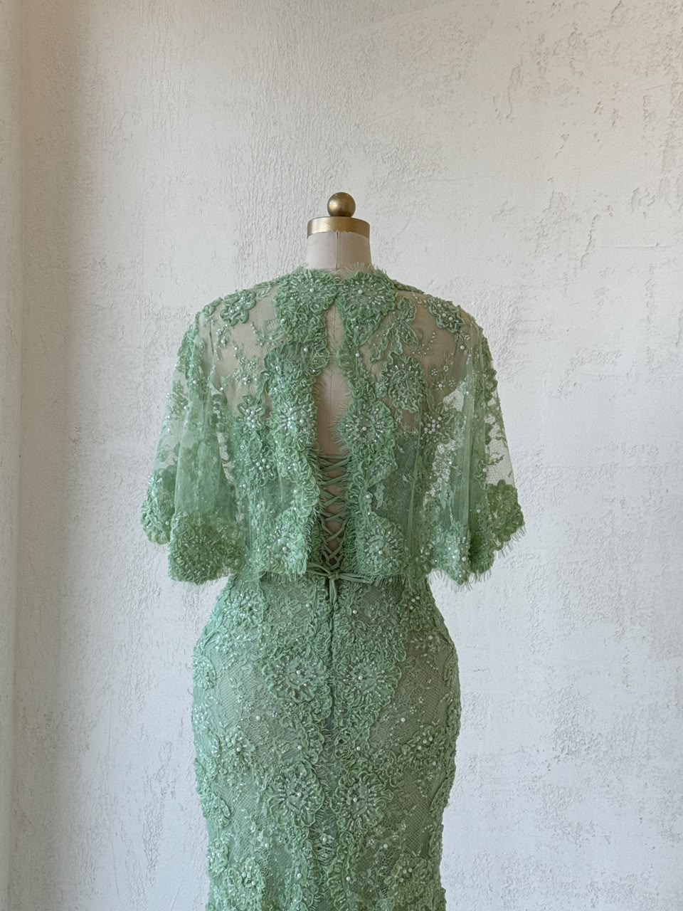 Green mermaid gown with embroidery, beading, lace, bolero and bow