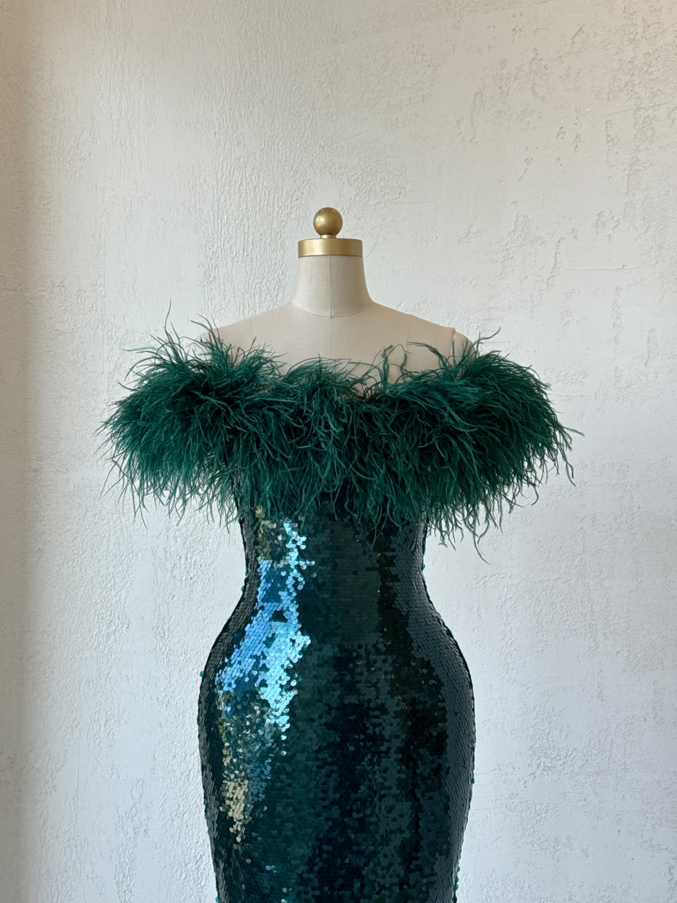 Green mermaid gown with sequins, embroidery, feathers and off the shoulder sleeves