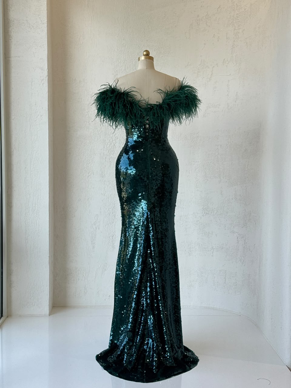 Green mermaid gown with sequins, embroidery, feathers and off the shoulder sleeves