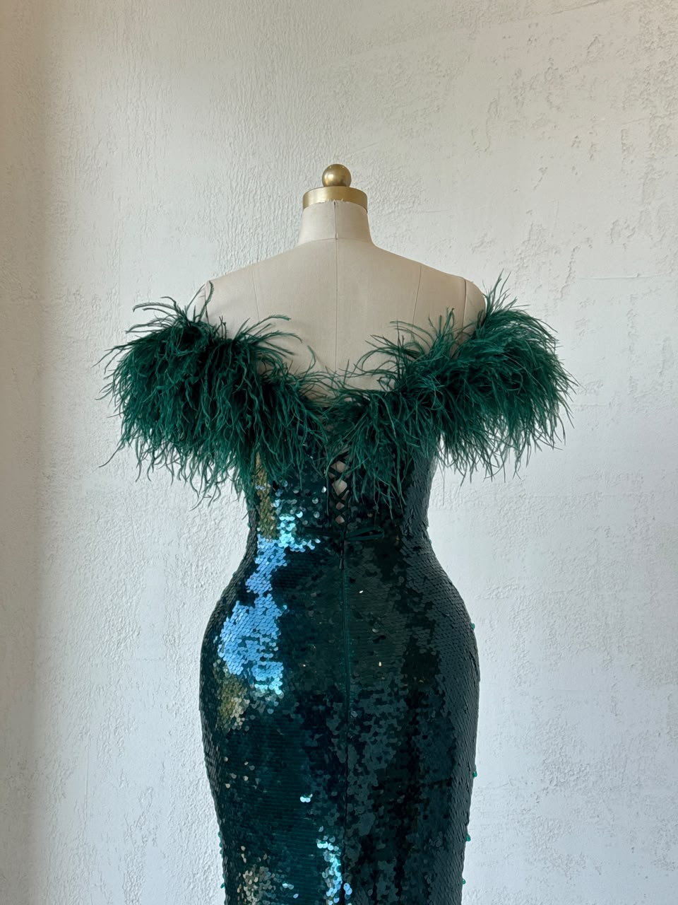 Green mermaid gown with sequins, embroidery, feathers and off the shoulder sleeves