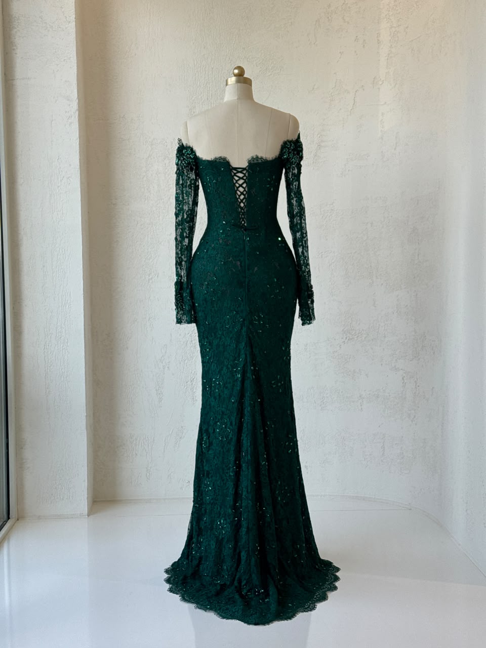 Green mermaid gown with long off the shoulder sleeves, embroidery and lace