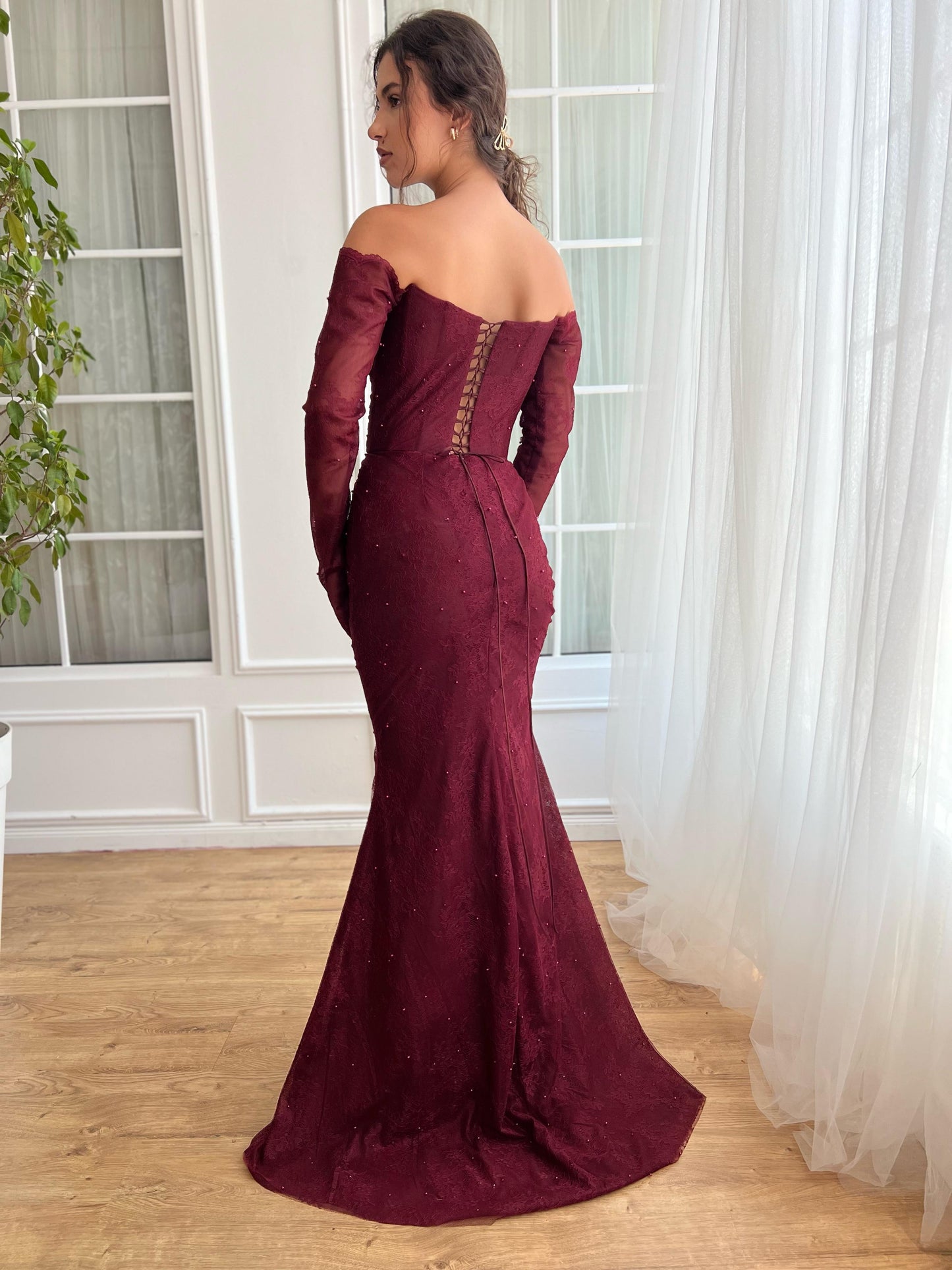 Red mermaid dress with long off the shoulder sleeves and embroidery