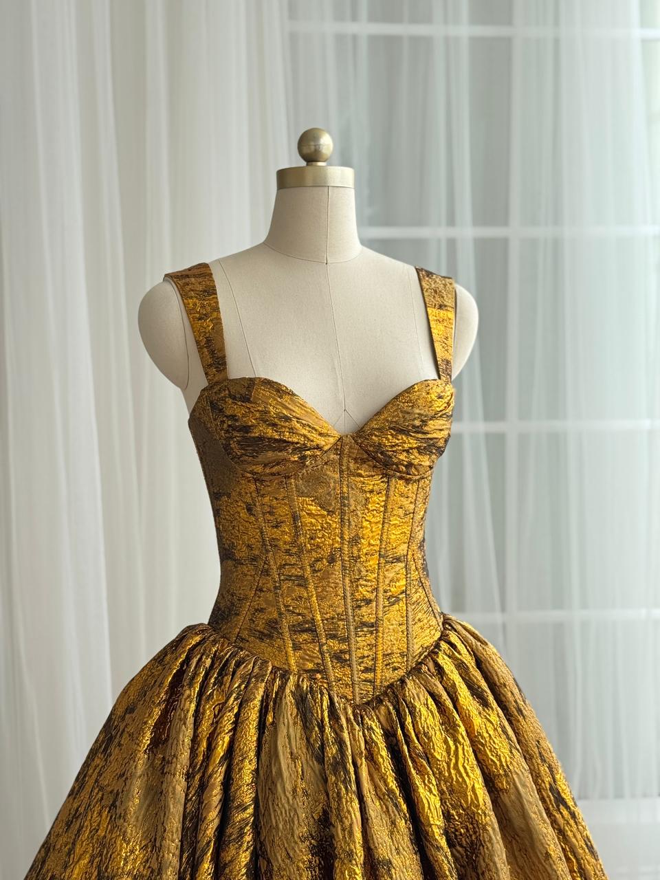 Gold A-Line gown with straps and brocade fabric