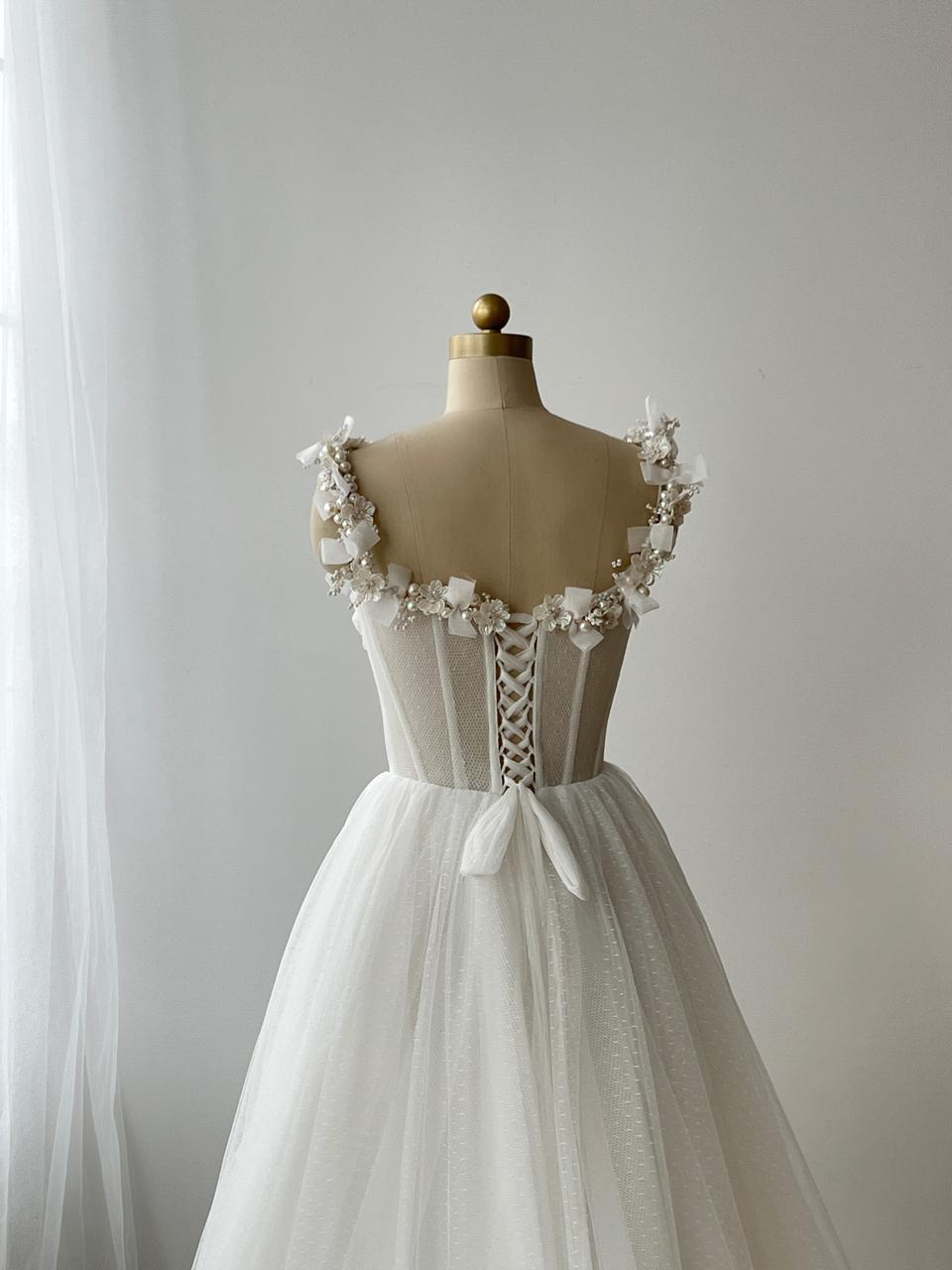 White bridal A-Line gown with straps, embroidery and pearls