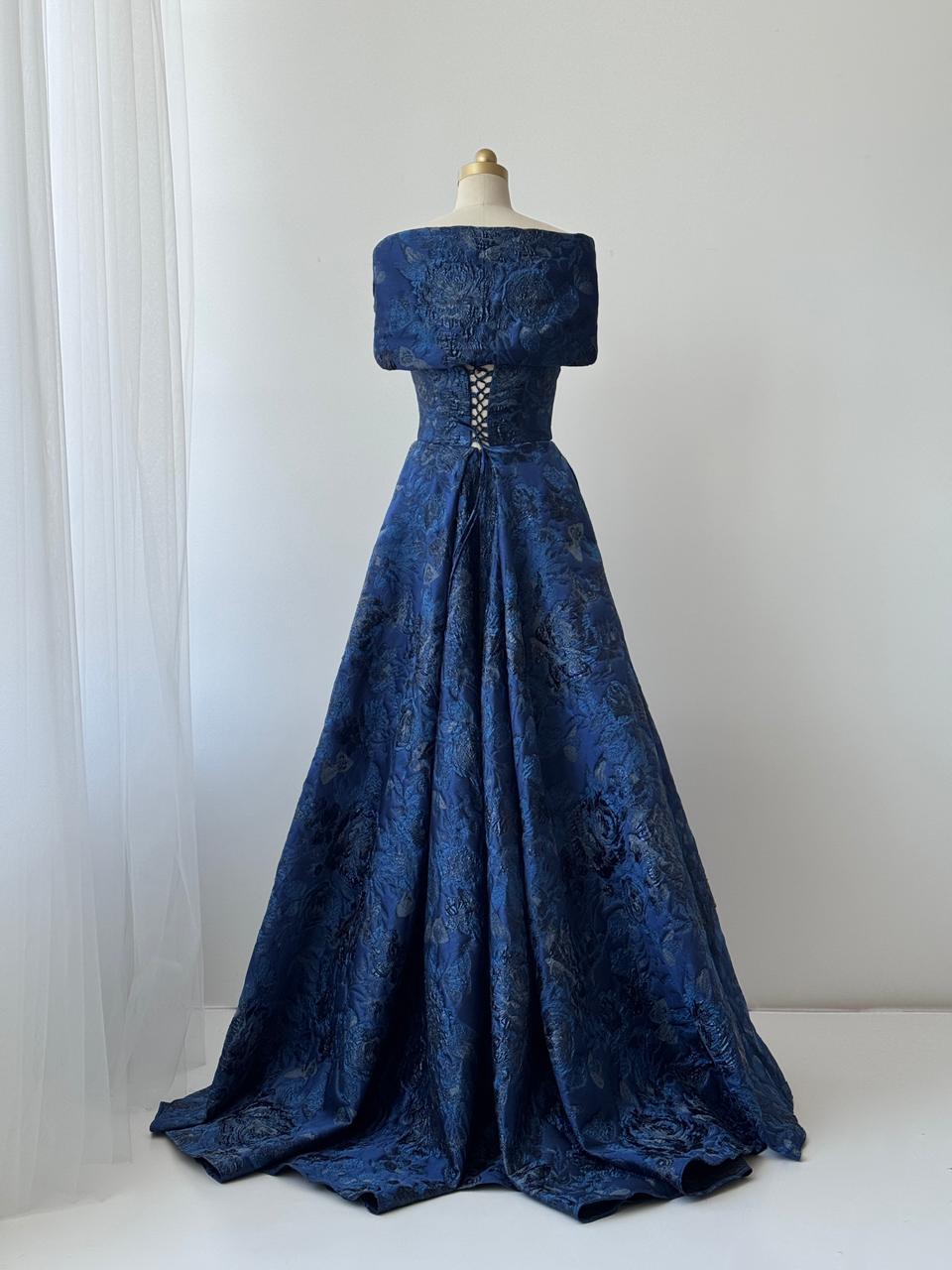 Blue A-Line gown with off the shoulder sleeves, embroidery and brocade fabric