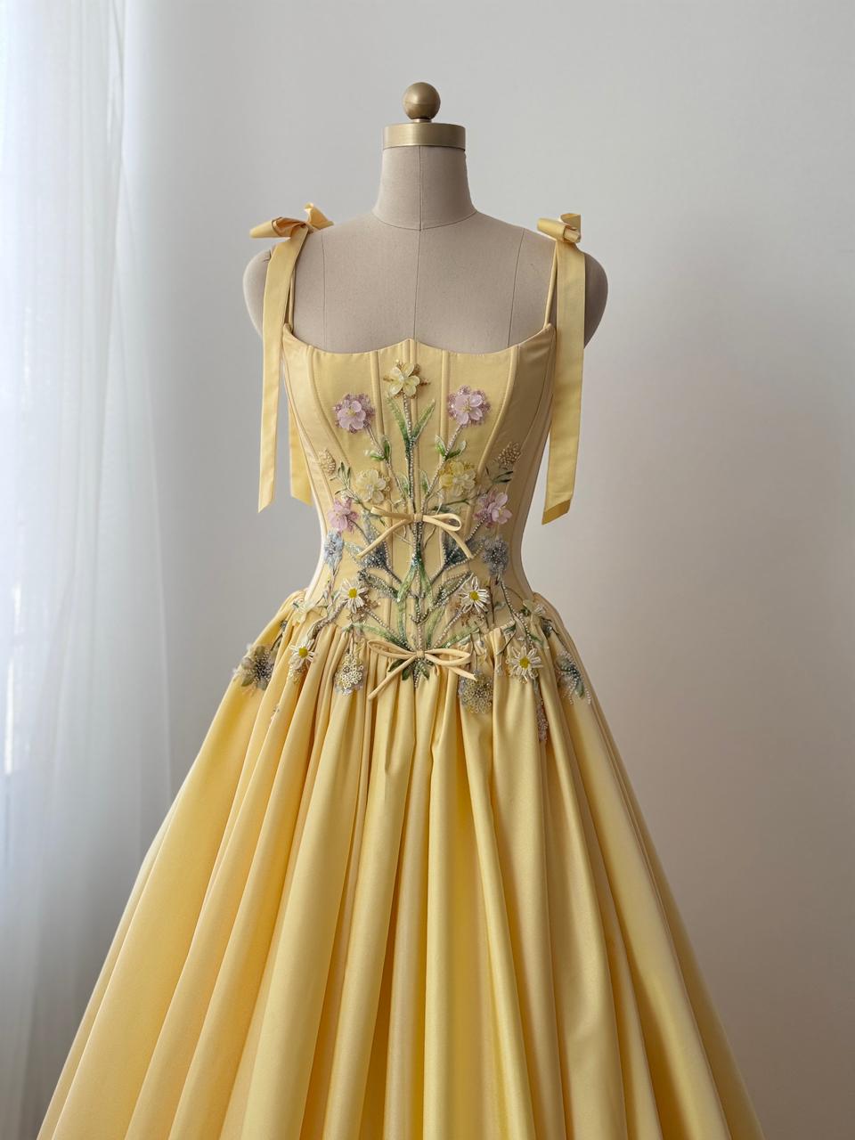 Yellow A-Line gown with embroidered bows, flowers and bow straps