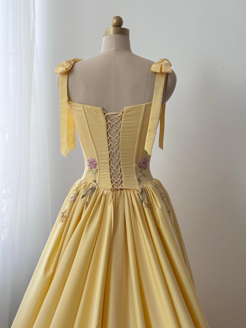 Yellow A-Line gown with embroidered bows, flowers and bow straps