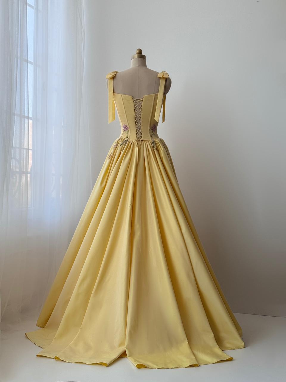 Yellow A-Line gown with embroidered bows, flowers and bow straps