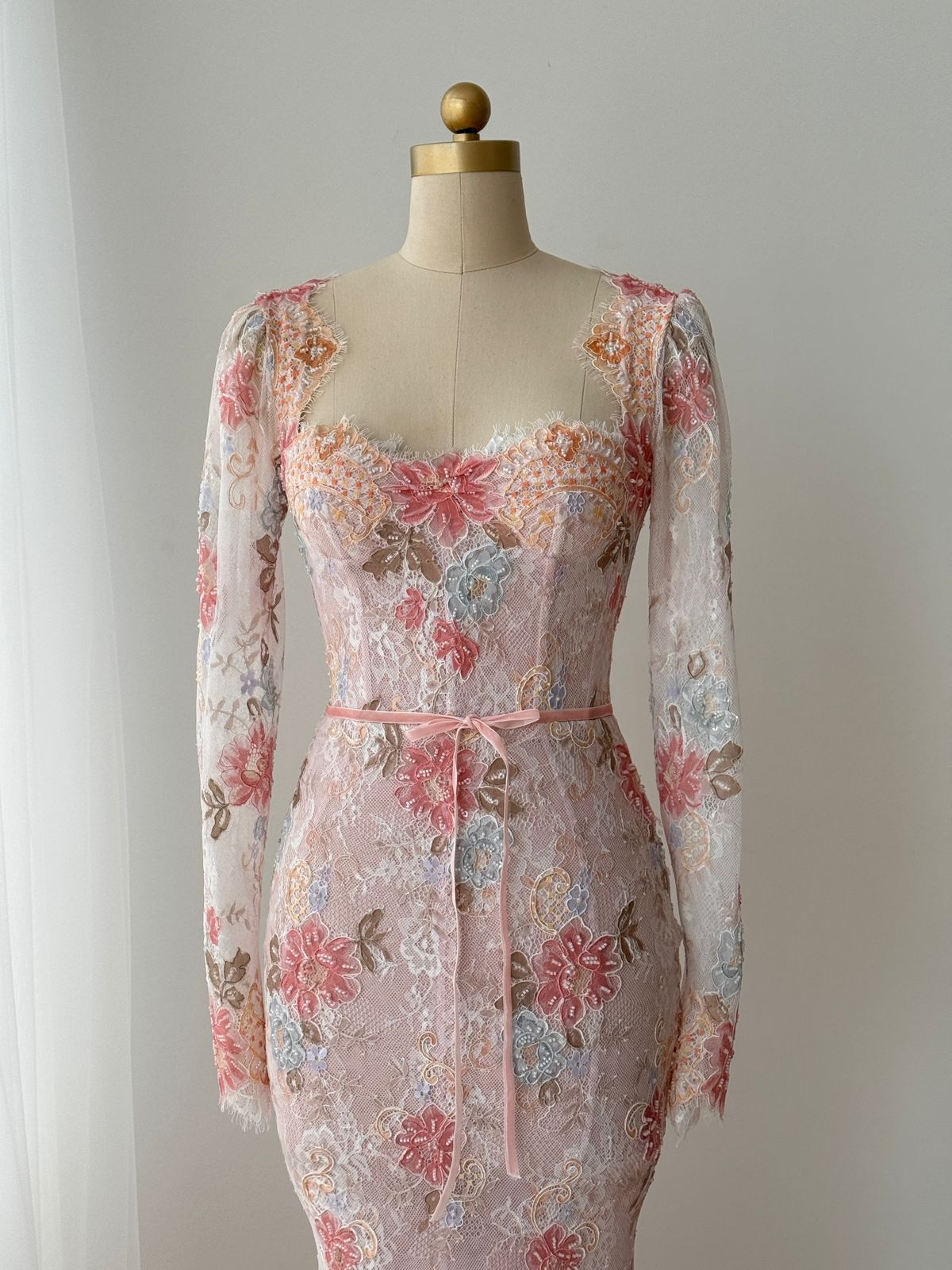 Pink mermaid gown with long sleeves, floral lace and embroidery