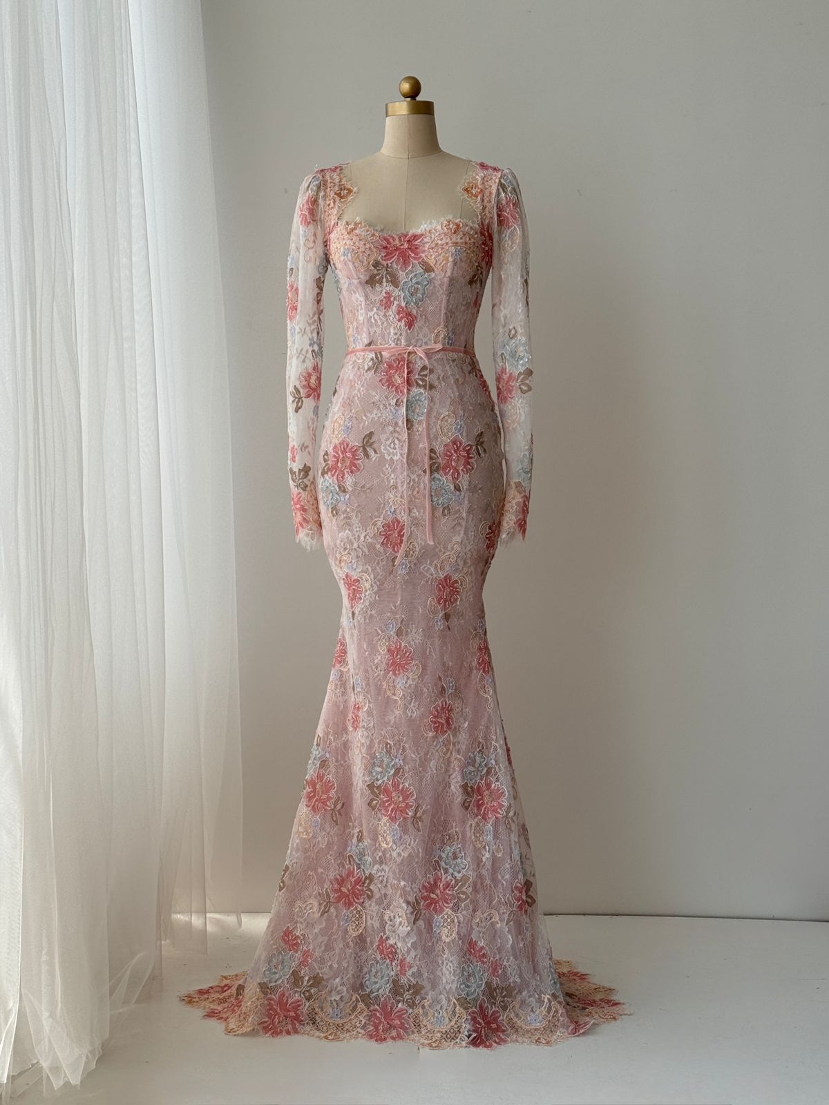 Pink mermaid gown with long sleeves, floral lace and embroidery