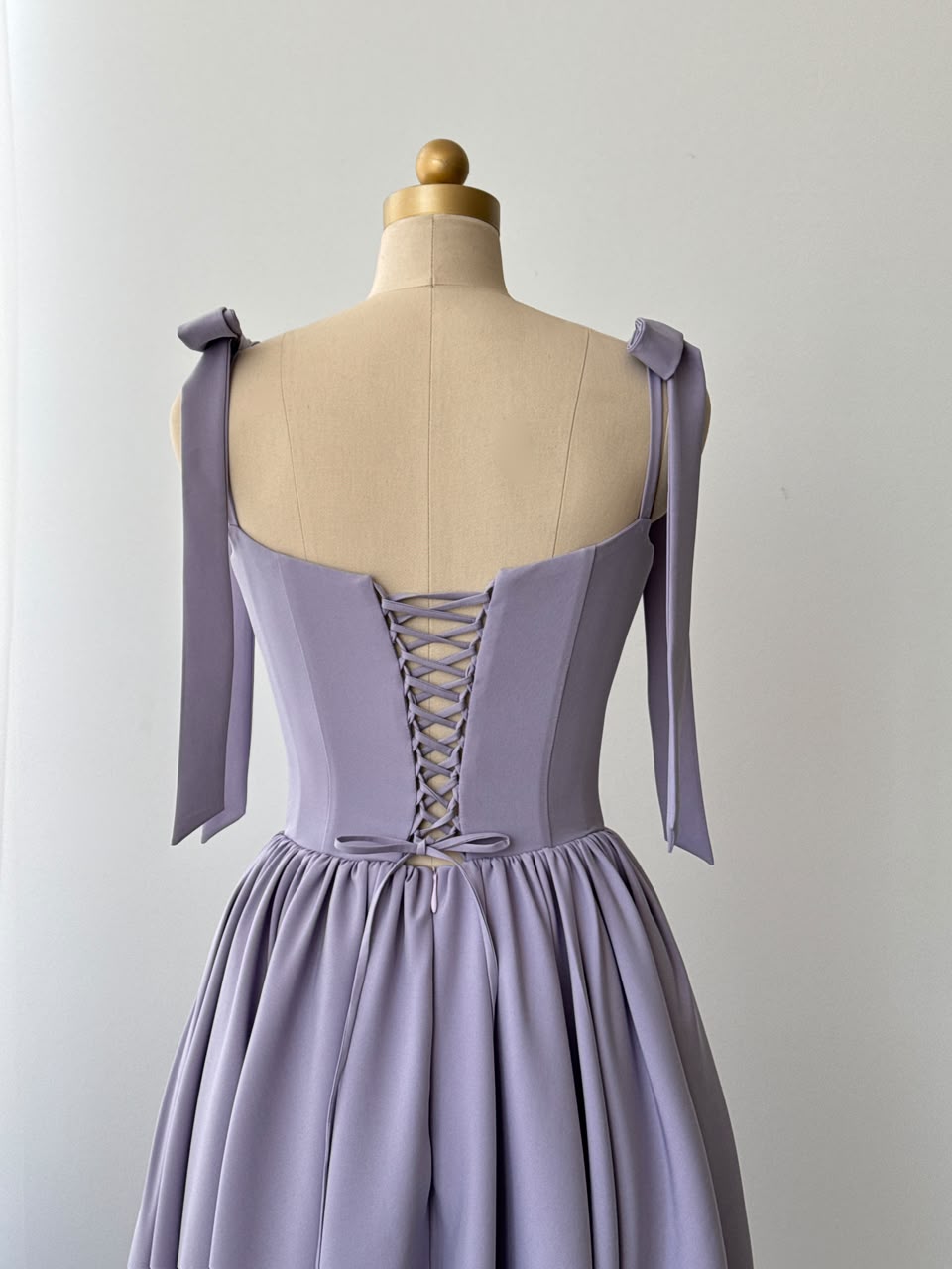 Purple midi dress with bow straps and embroidered lace