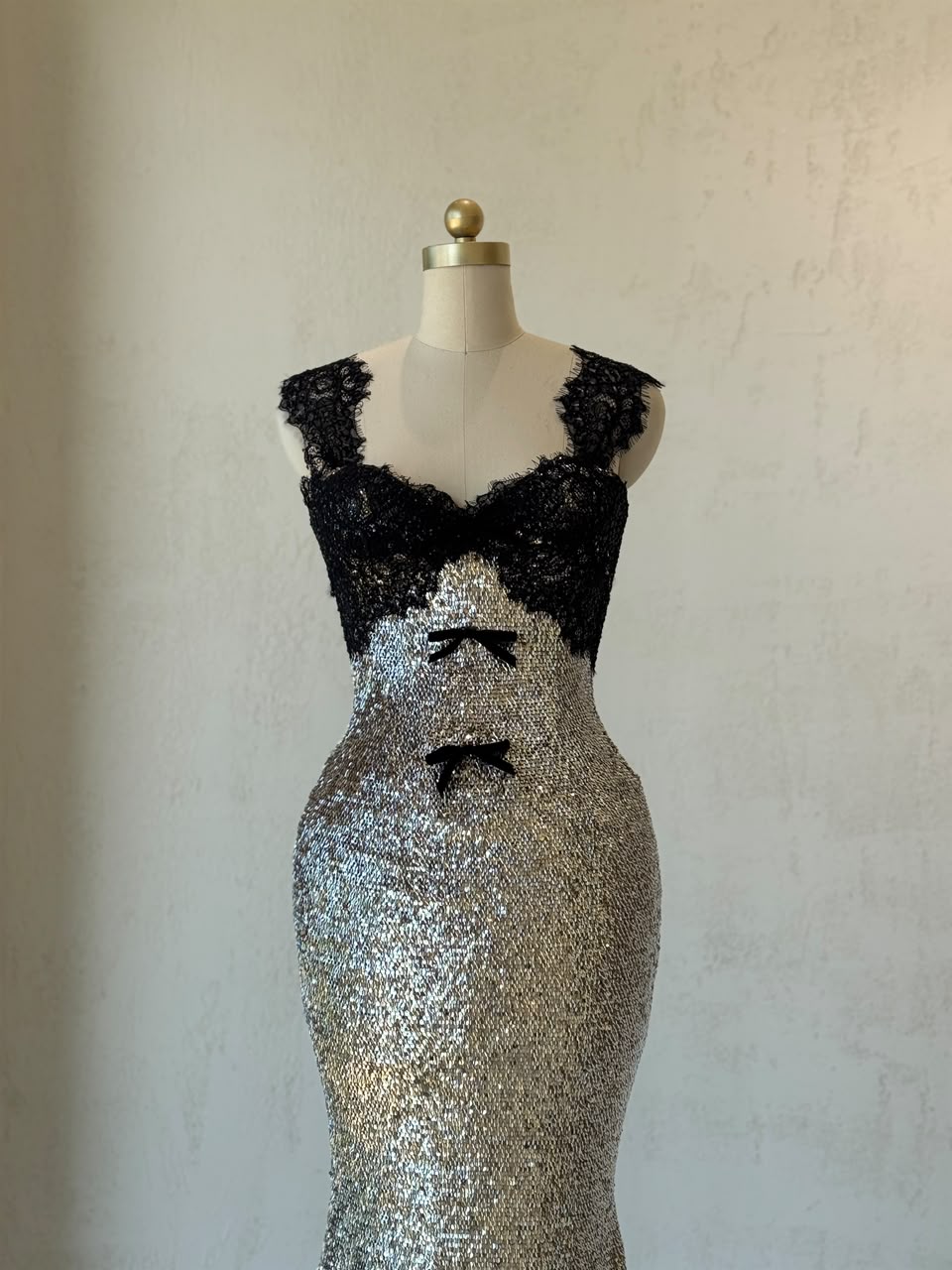 Black and grey mermaid gown with lace, sequins, embroidered bows and straps