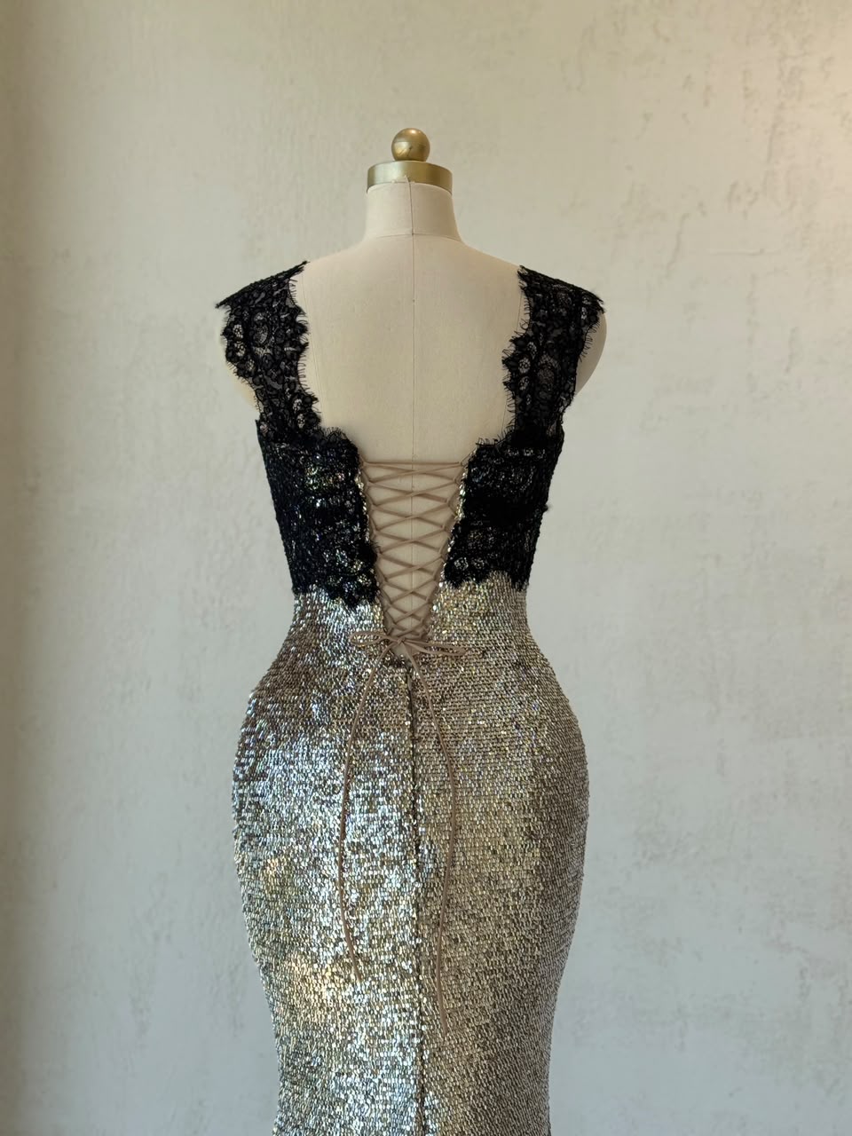 Black and grey mermaid gown with lace, sequins, embroidered bows and straps