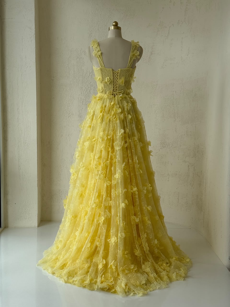 Yellow A-Line gown with spaghetti straps and embroidery