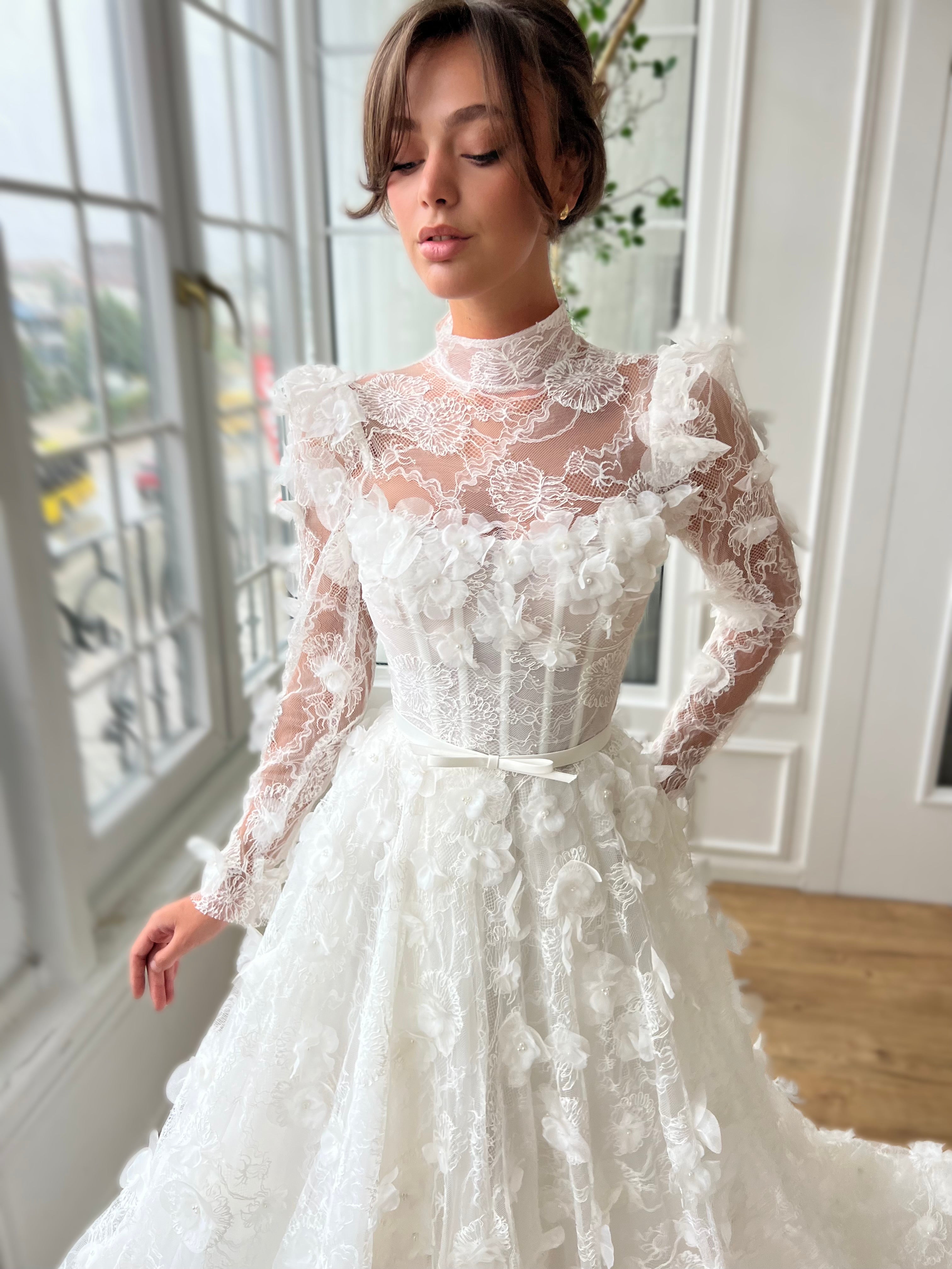 White bridal A-Line gown with long sleeves and embroidery
