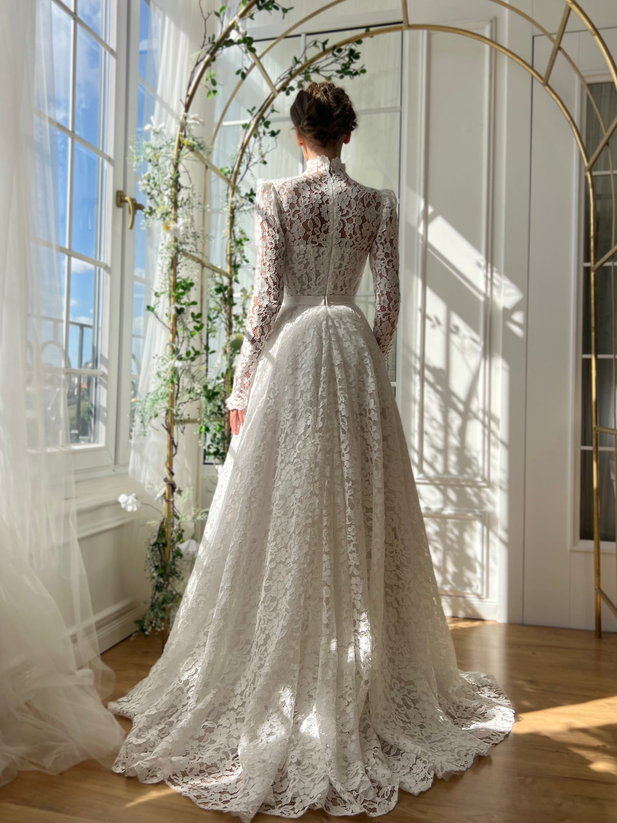 White bridal A-Line gown with long sleeves and embroidery