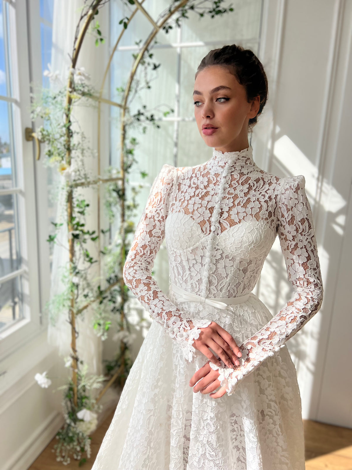 White bridal A-Line gown with long sleeves and embroidery