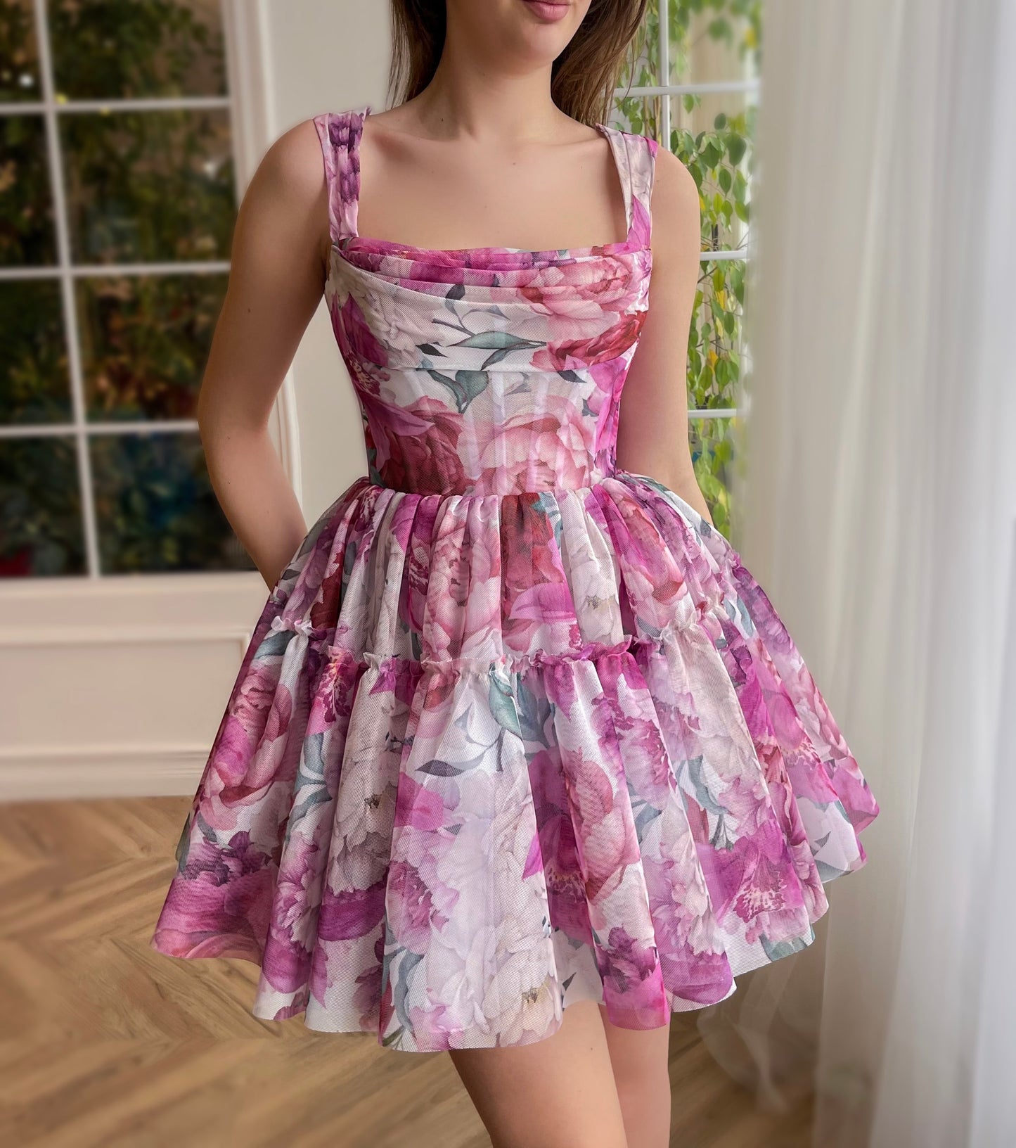 Pink mini dress with printed flowers and straps