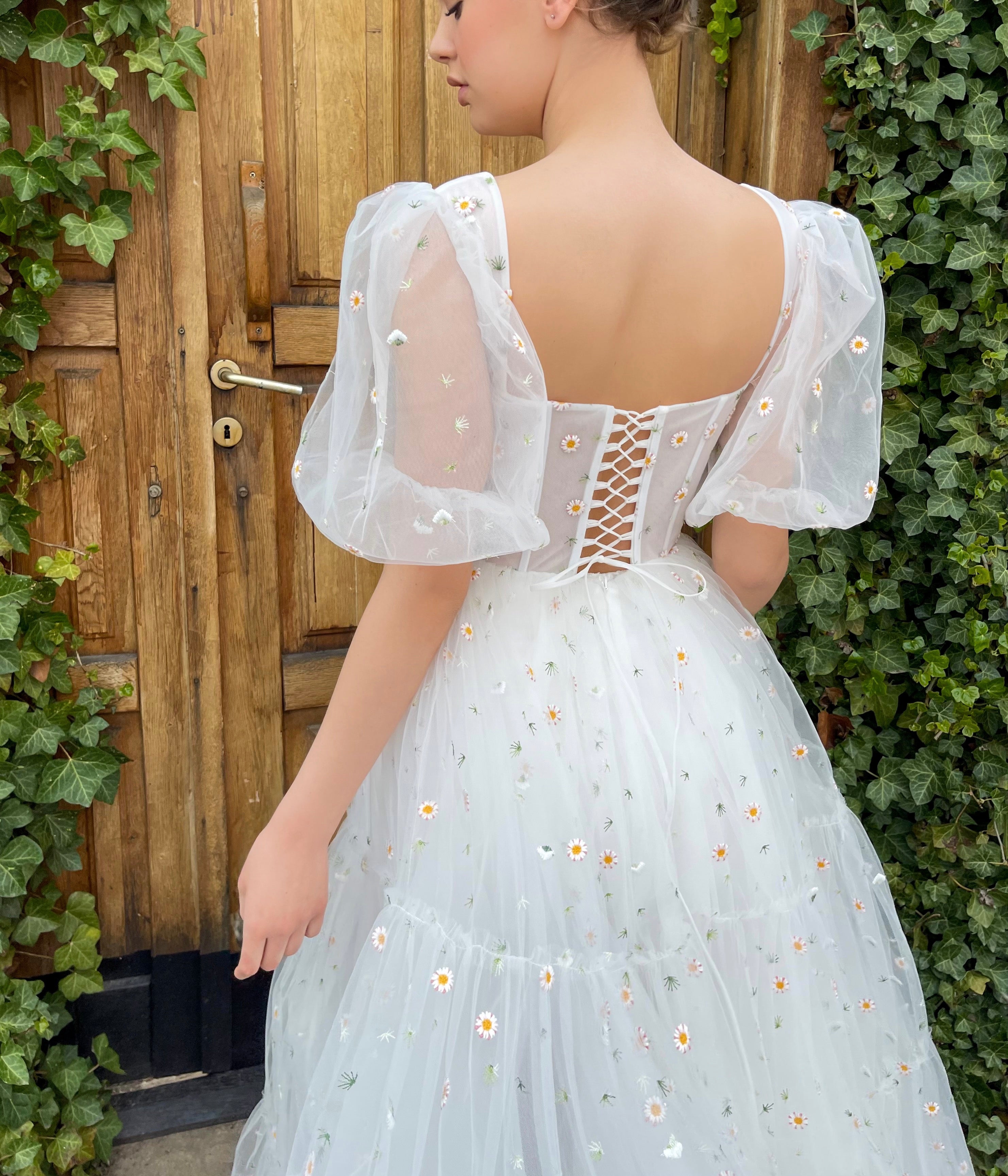 White A-Line bridal dress with short sleeves and embroidered daisies