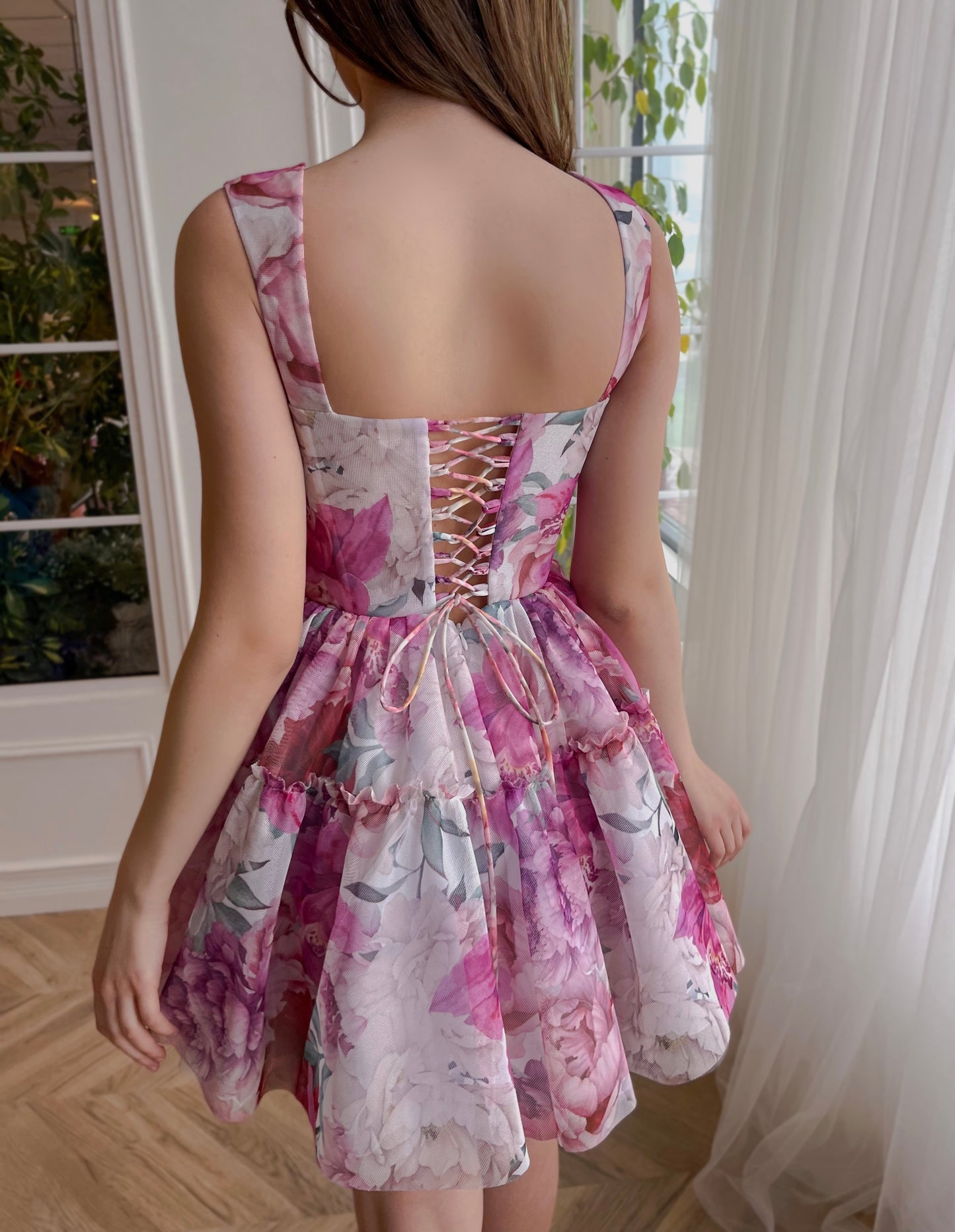 Pink mini dress with printed flowers and straps