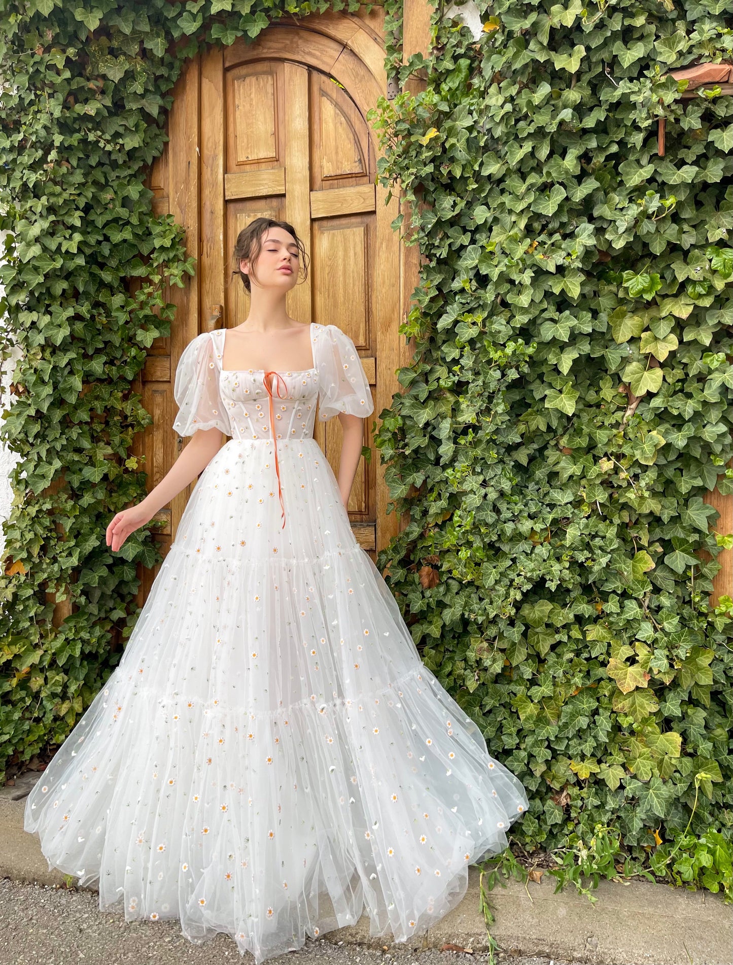 White A-Line bridal dress with short sleeves and embroidered daisies