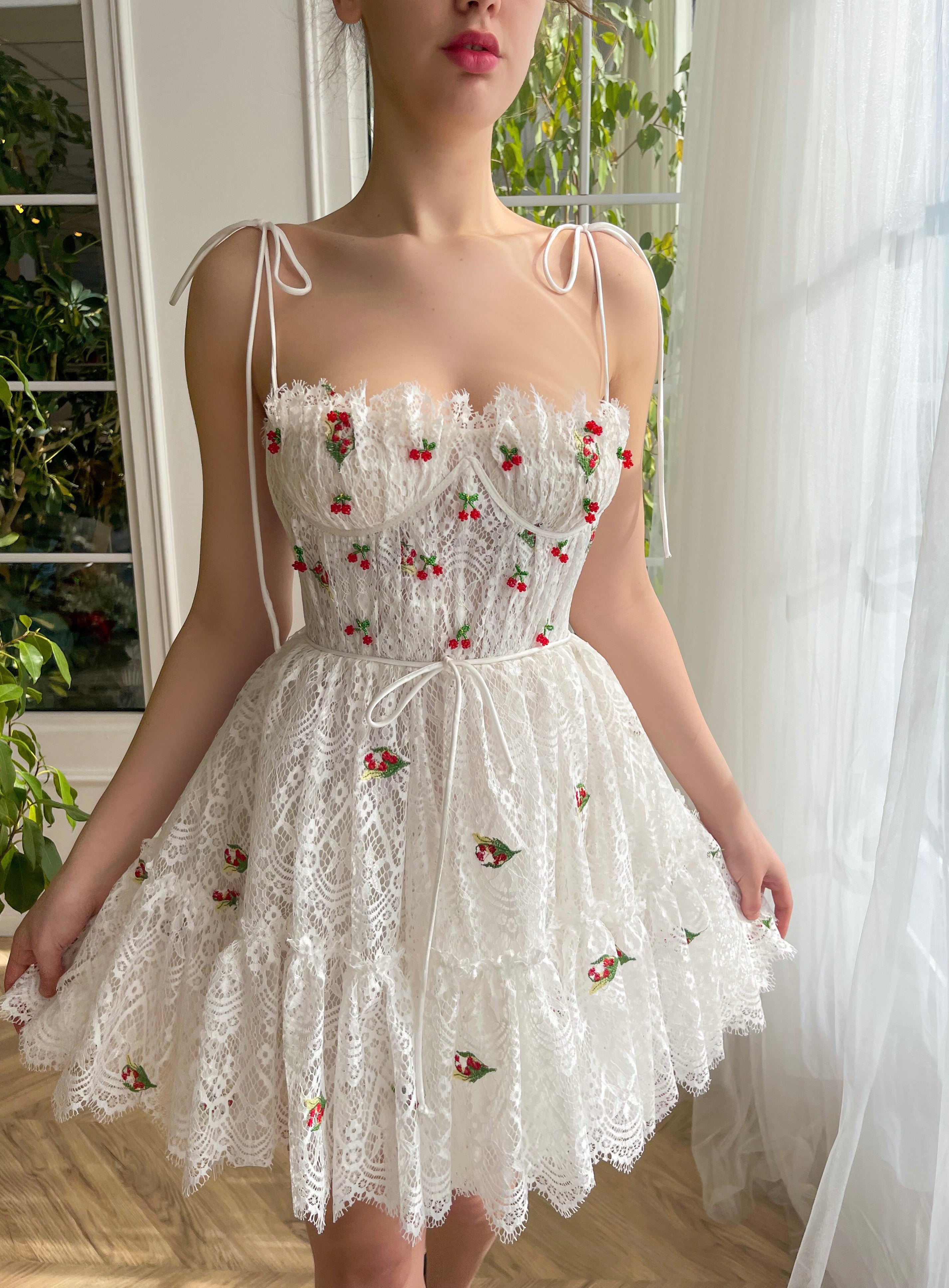 White mini dress with spaghetti straps and embroidered cherries