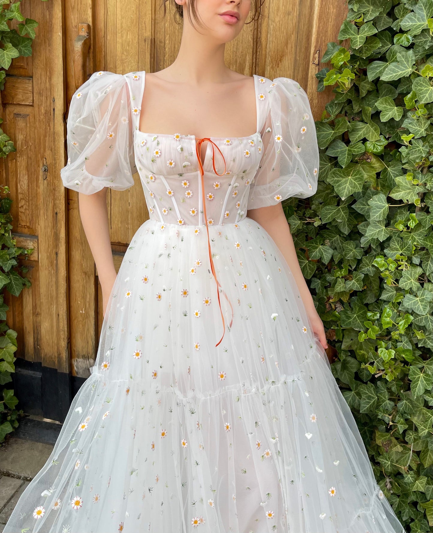 White A-Line bridal dress with short sleeves and embroidered daisies