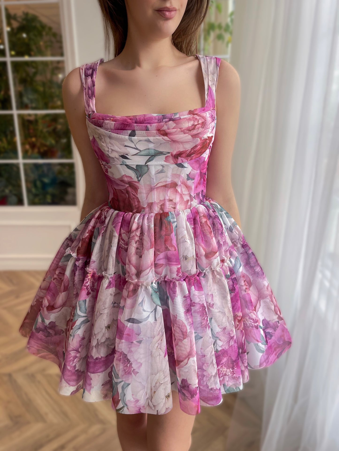 Pink mini dress with printed flowers and straps