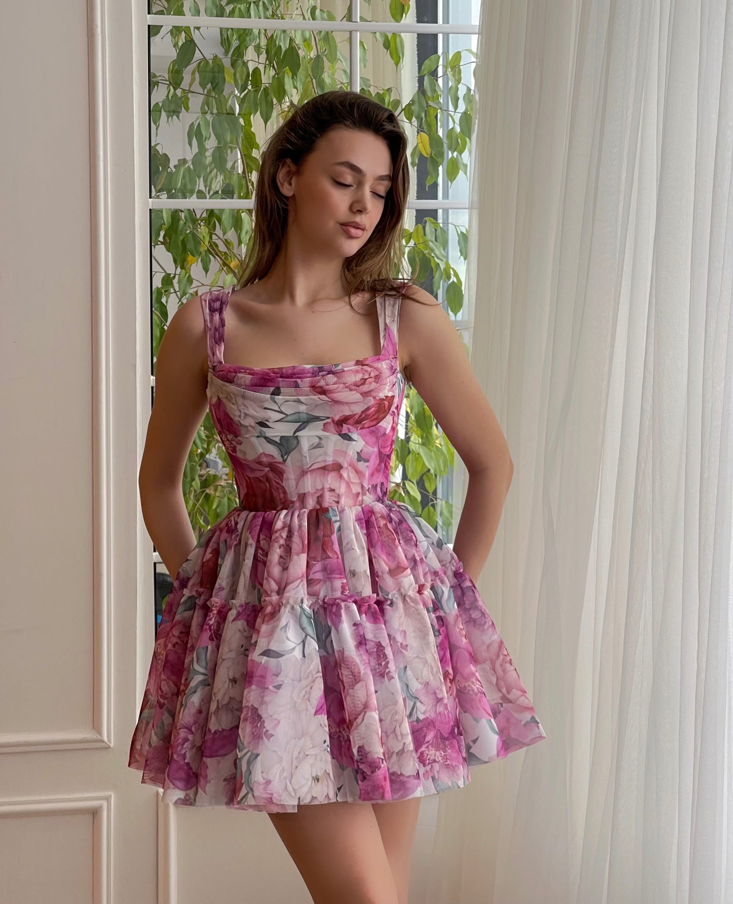 Pink mini dress with printed flowers and straps