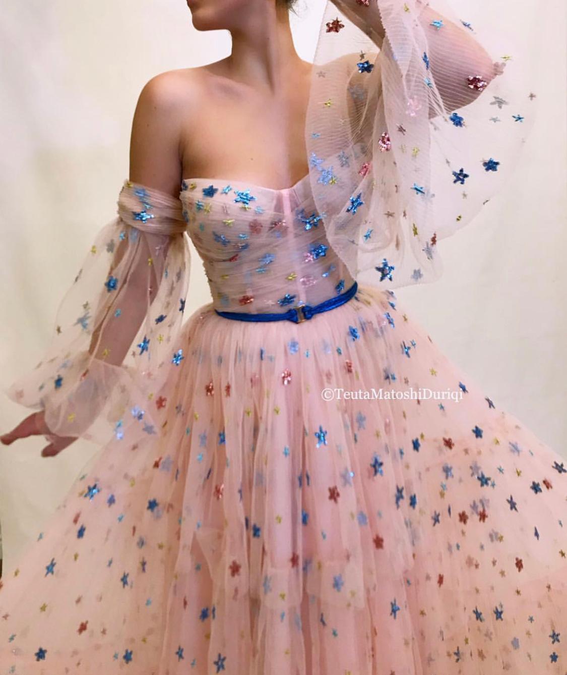Pink A-Line dress with belt, long off the shoulder sleeves and starry fabric