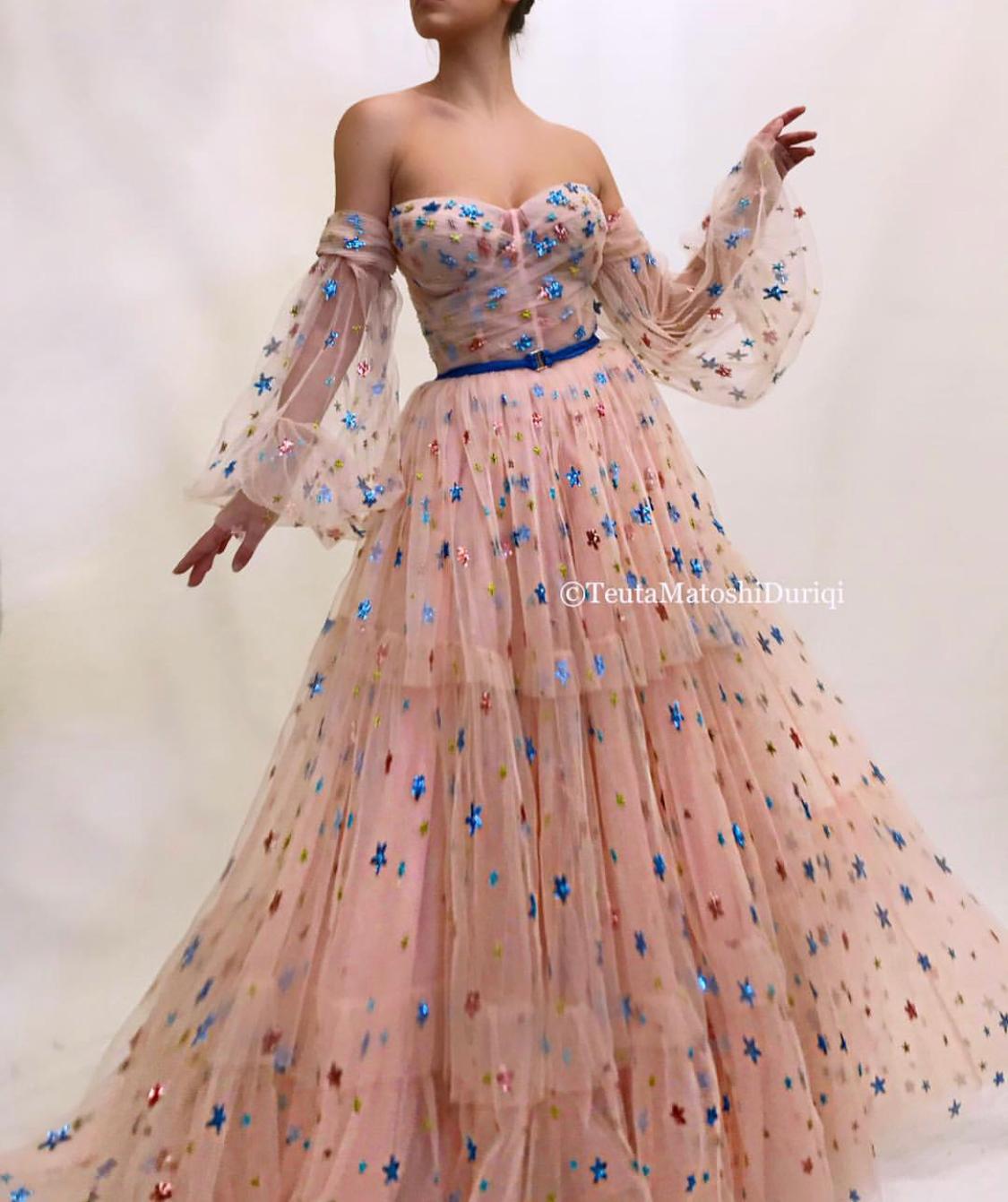 Pink A-Line dress with belt, long off the shoulder sleeves and starry fabric