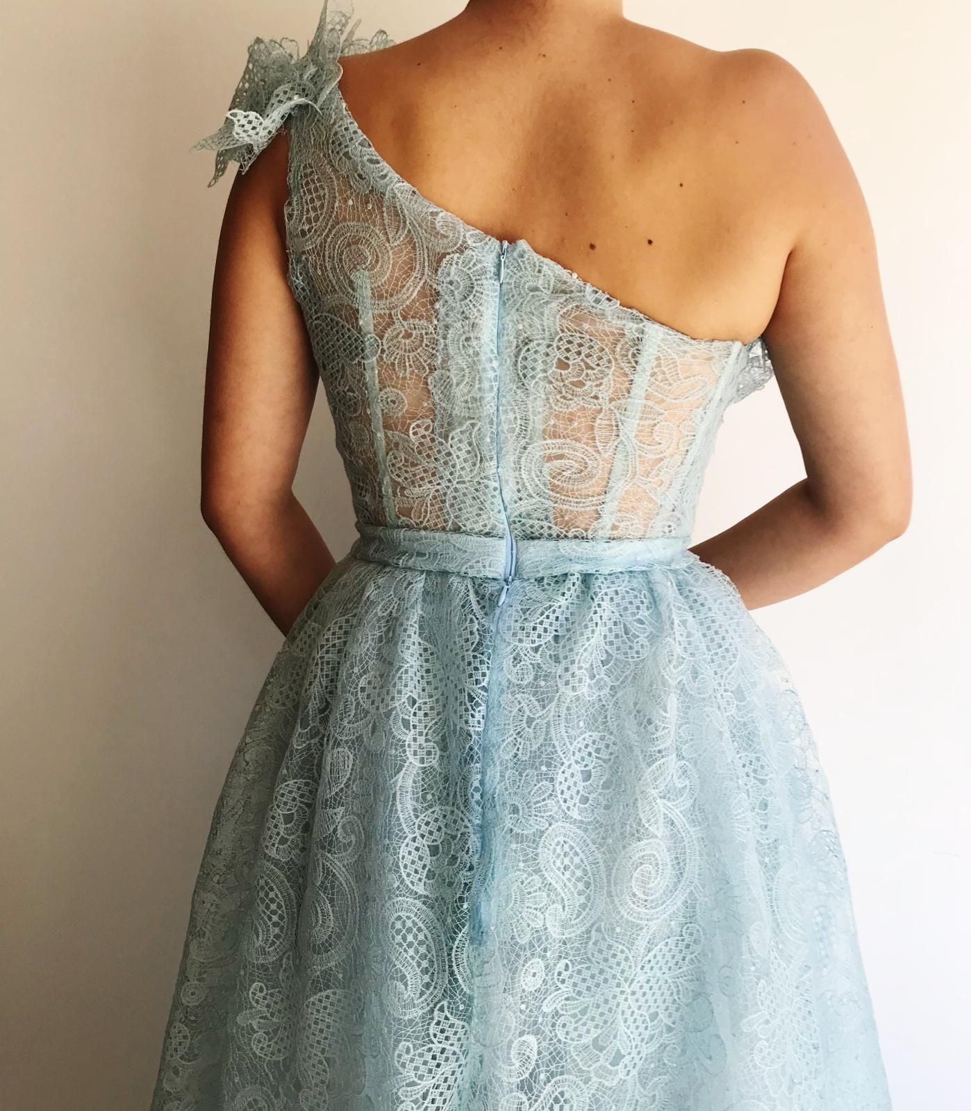 Blue overskirt dress with one shoulder sleeve and lace