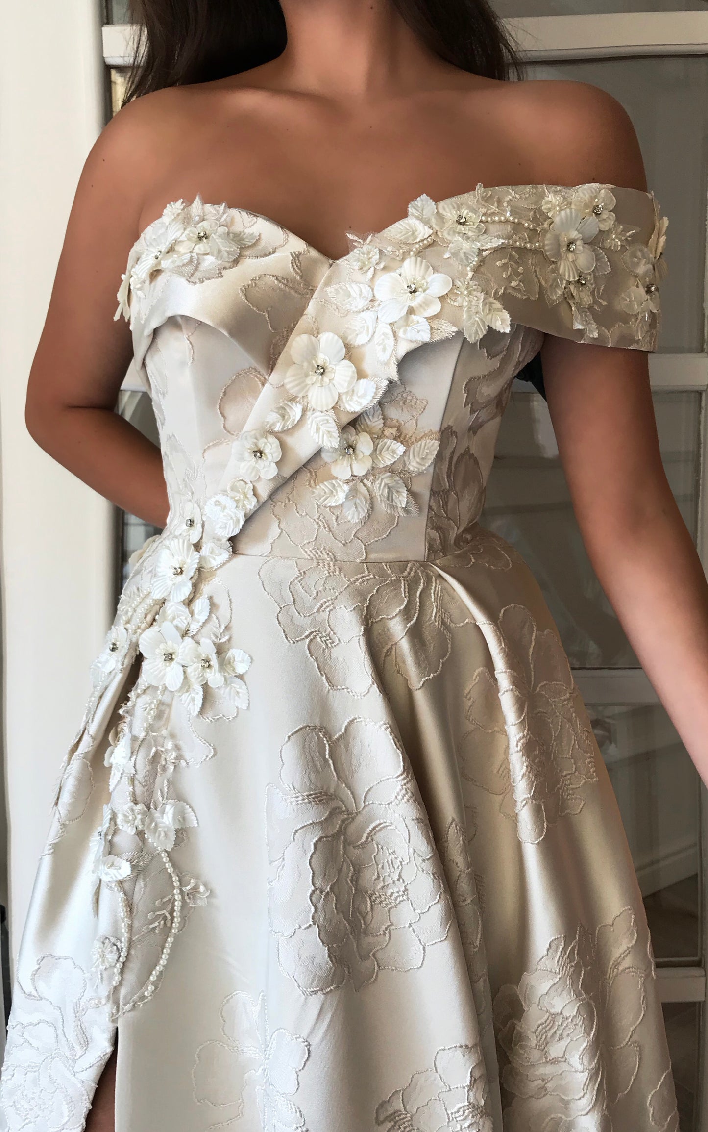 White A-Line dress with one off the shoulder sleeve and embroidery