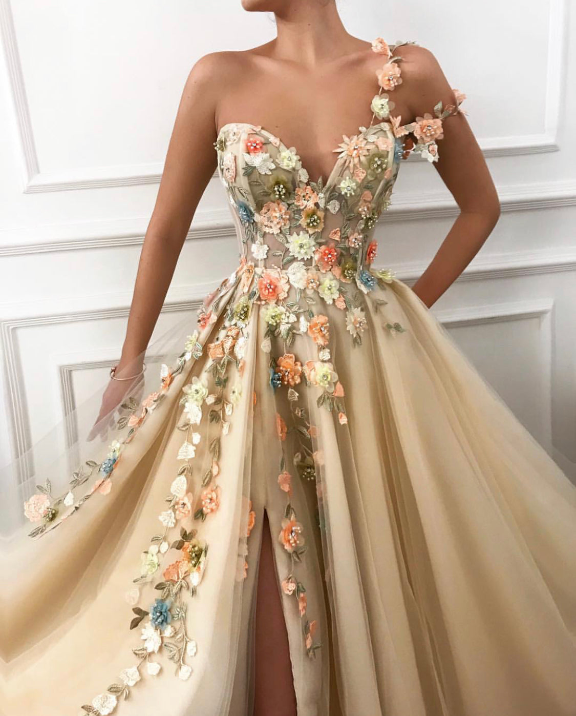 Beige A-Line dress with one shoulder and off the shoulder sleeve, v-neck and embroidered flowers