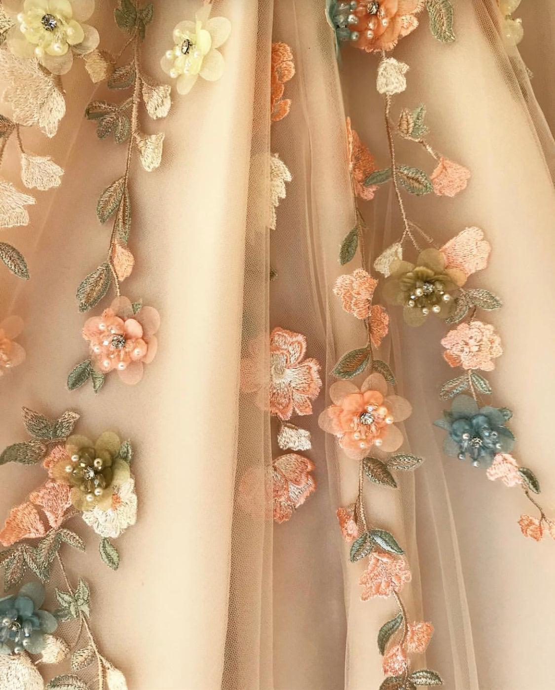 Beige A-Line dress with one shoulder and off the shoulder sleeve, v-neck and embroidered flowers