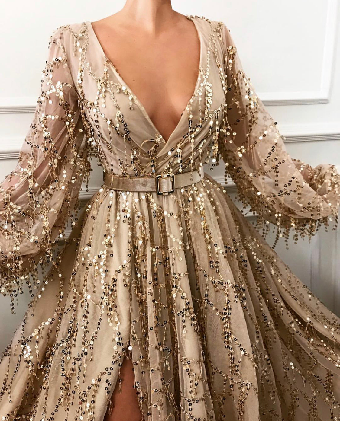 Gold A-Line dress with belt, v-neck, sequins and long sleeves