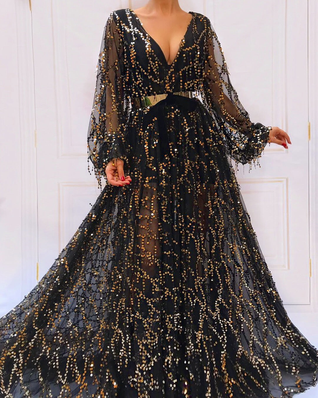 Black A-Line dress with v-neck, long sleeves and sequins