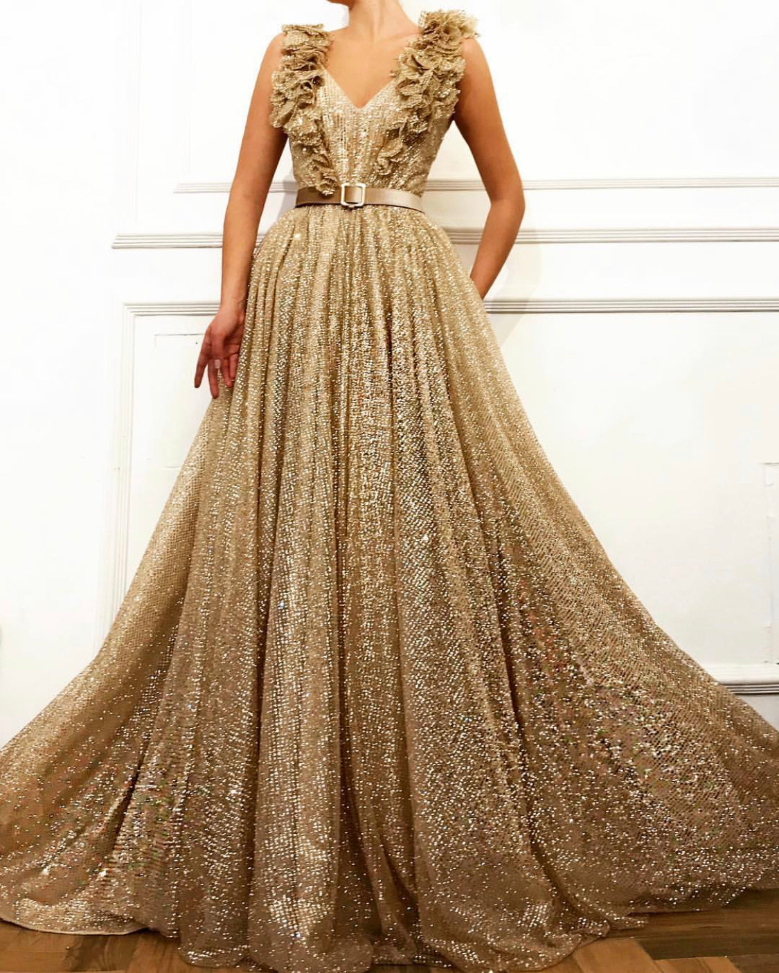 Gold A-Line dress with no sleeves, belt and embroidery